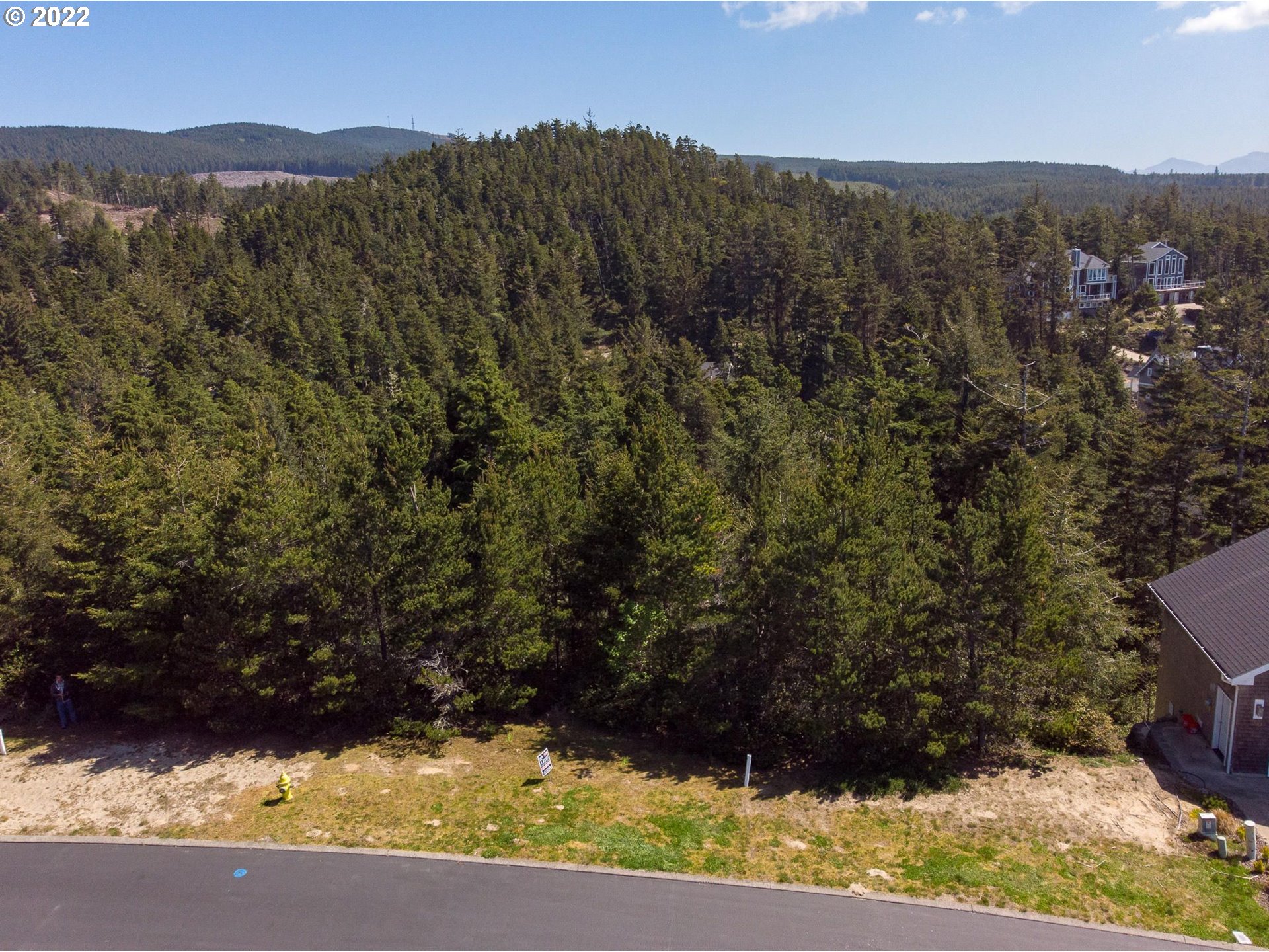 Promontory Lane Tillamook, OR 97141 - Photo 11 of 11 a view of a yard with wooden fence
