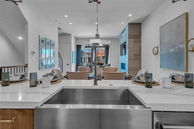 a view of a dining room with furniture wooden floor and chandelier