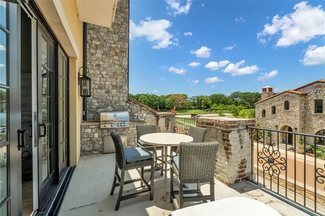 a living room with furniture fireplace and flat screen tv