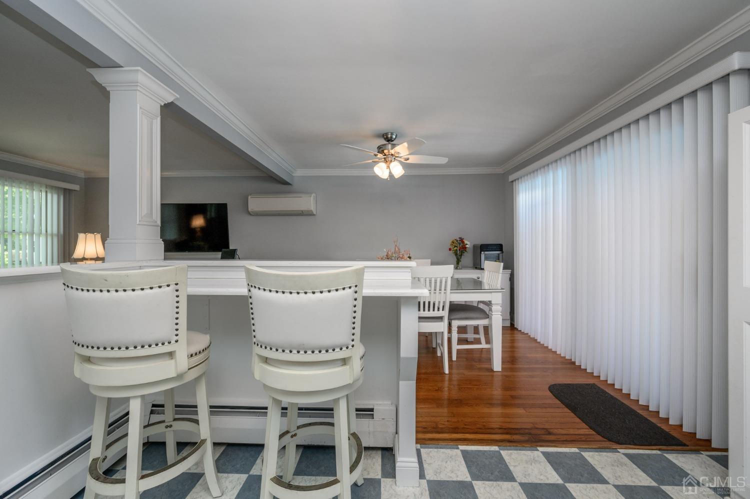 54 Manito Road Manasquan, NJ 08736 - Photo 15 of 47 a view of a dining room with furniture and wooden floor