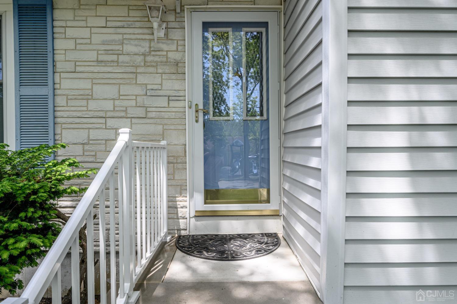 54 Manito Road Manasquan, NJ 08736 - Photo 2 of 47 a view of wooden door with a window