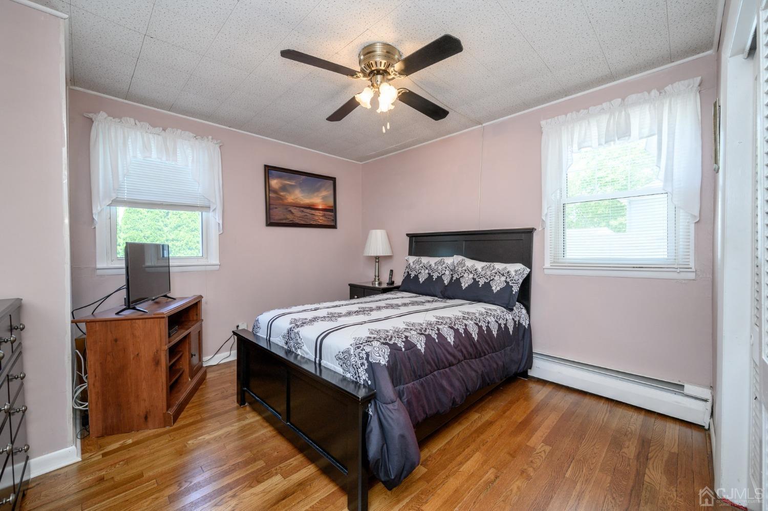 54 Manito Road Manasquan, NJ 08736 - Photo 21 of 47 a bed room with a bed and a window