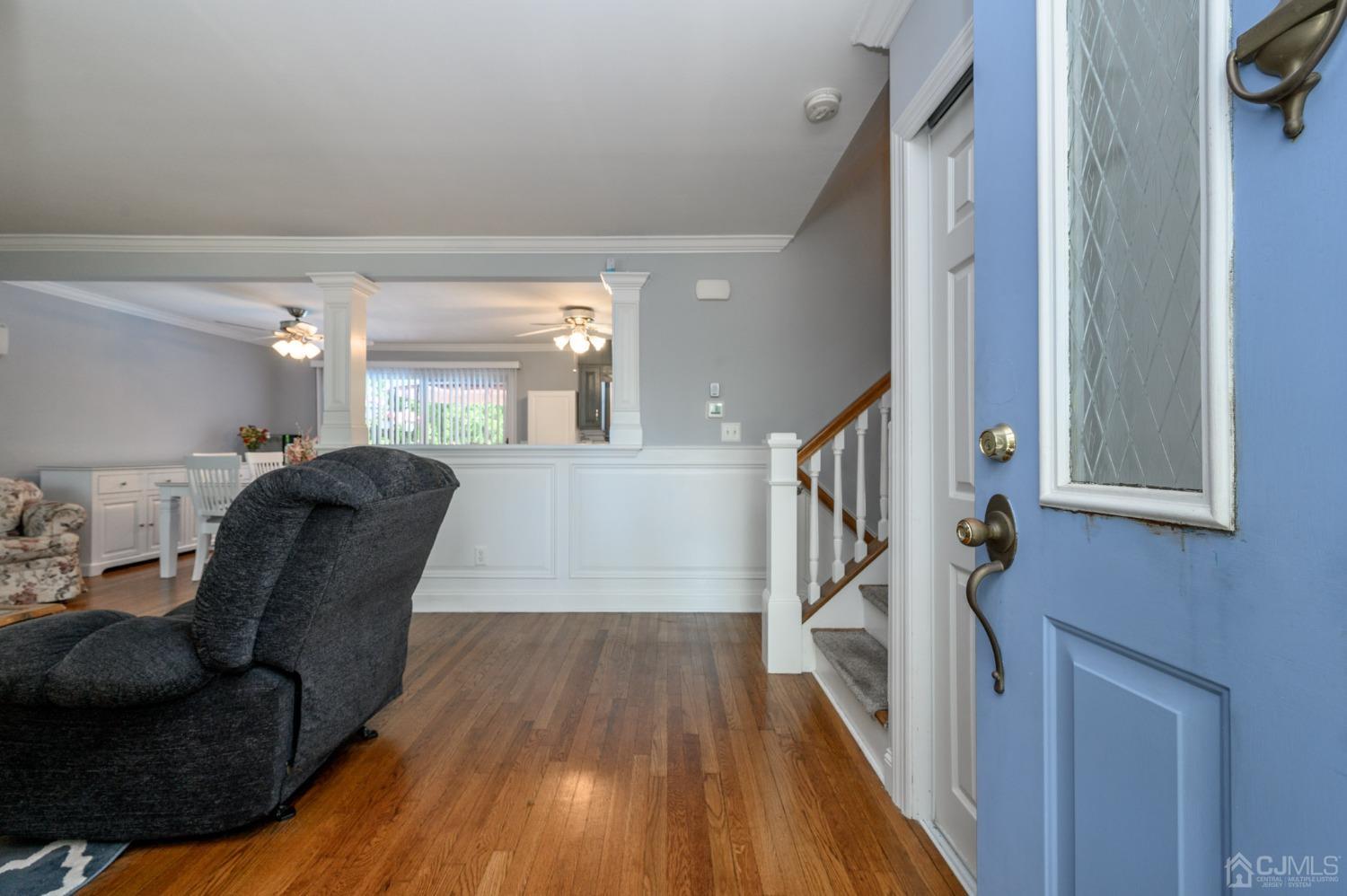 54 Manito Road Manasquan, NJ 08736 - Photo 3 of 47 a living room with furniture and a wooden floor