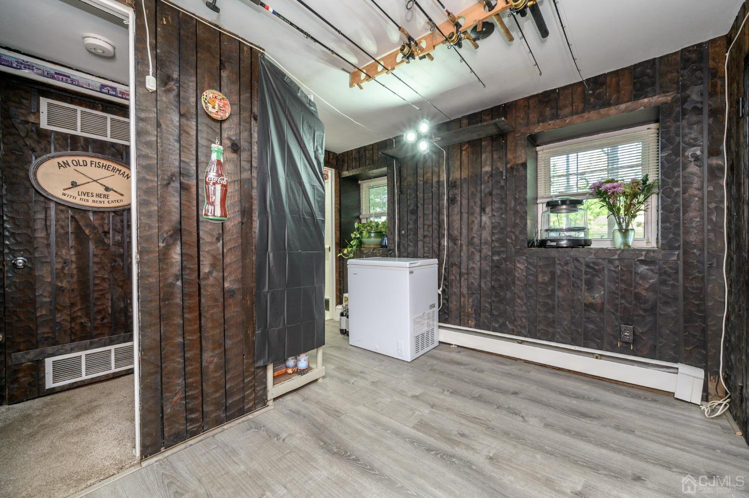 54 Manito Road Manasquan, NJ 08736 - Photo 31 of 47 a view of a hallway with wooden floor and windows