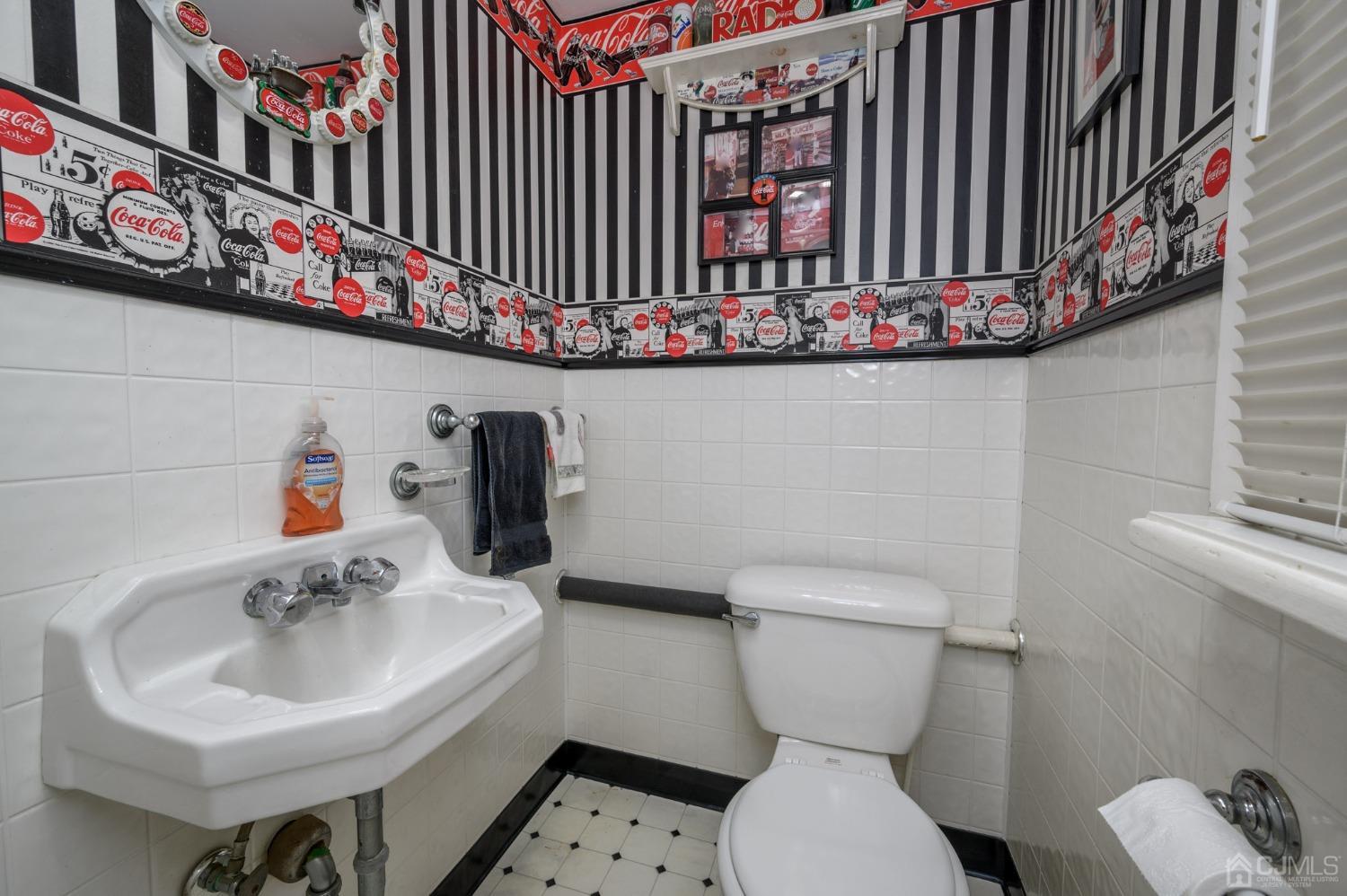 54 Manito Road Manasquan, NJ 08736 - Photo 33 of 47 a bathroom with a sink a toilet and a mirror