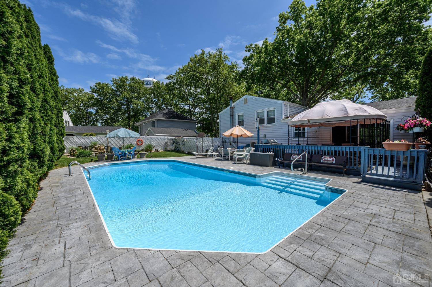 54 Manito Road Manasquan, NJ 08736 - Photo 34 of 47 a view of a house with swimming pool and sitting area