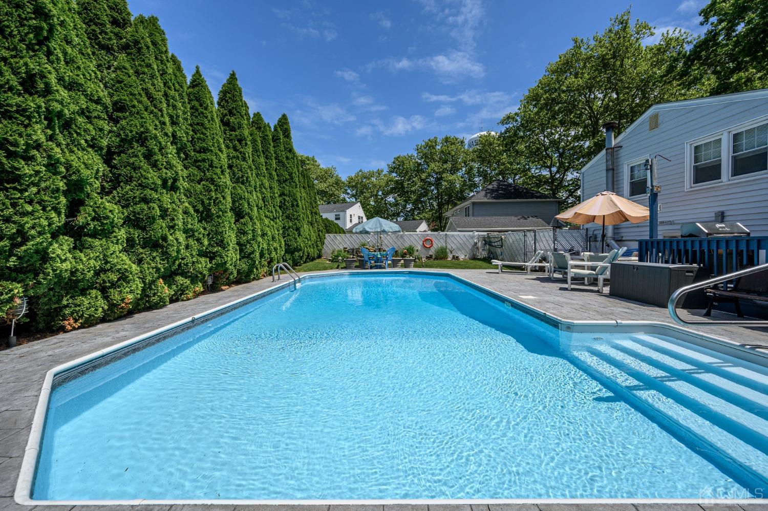54 Manito Road Manasquan, NJ 08736 - Photo 36 of 47 a swimming pool view with a outdoor seating