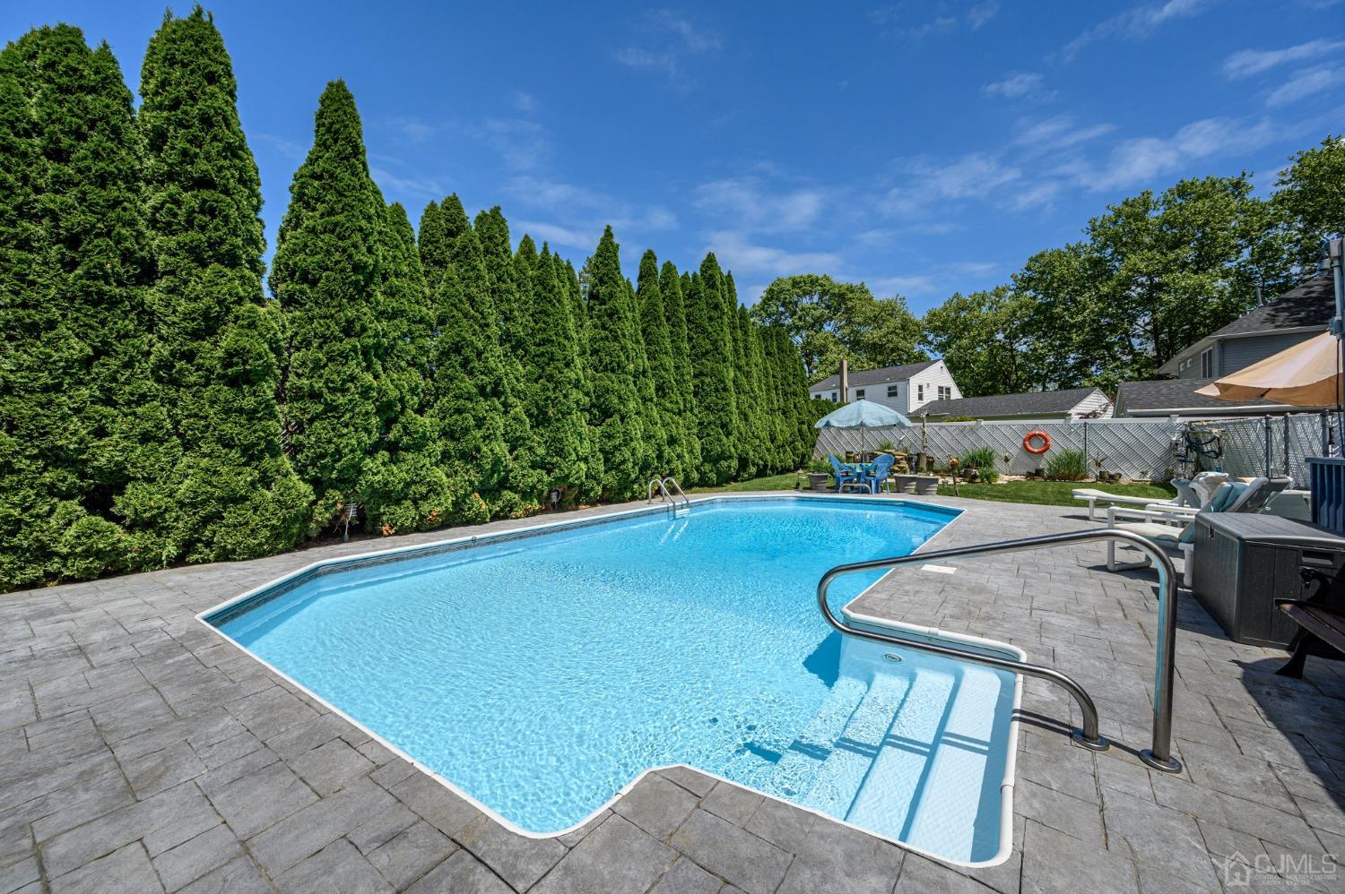 54 Manito Road Manasquan, NJ 08736 - Photo 37 of 47 a view of a chairs and table in the patio