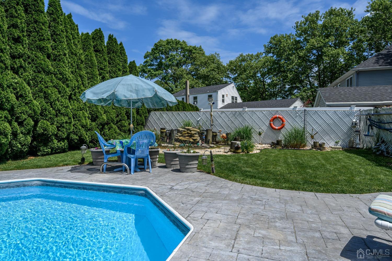 54 Manito Road Manasquan, NJ 08736 - Photo 38 of 47 a view of outdoor space yard deck patio and outdoor kitchen