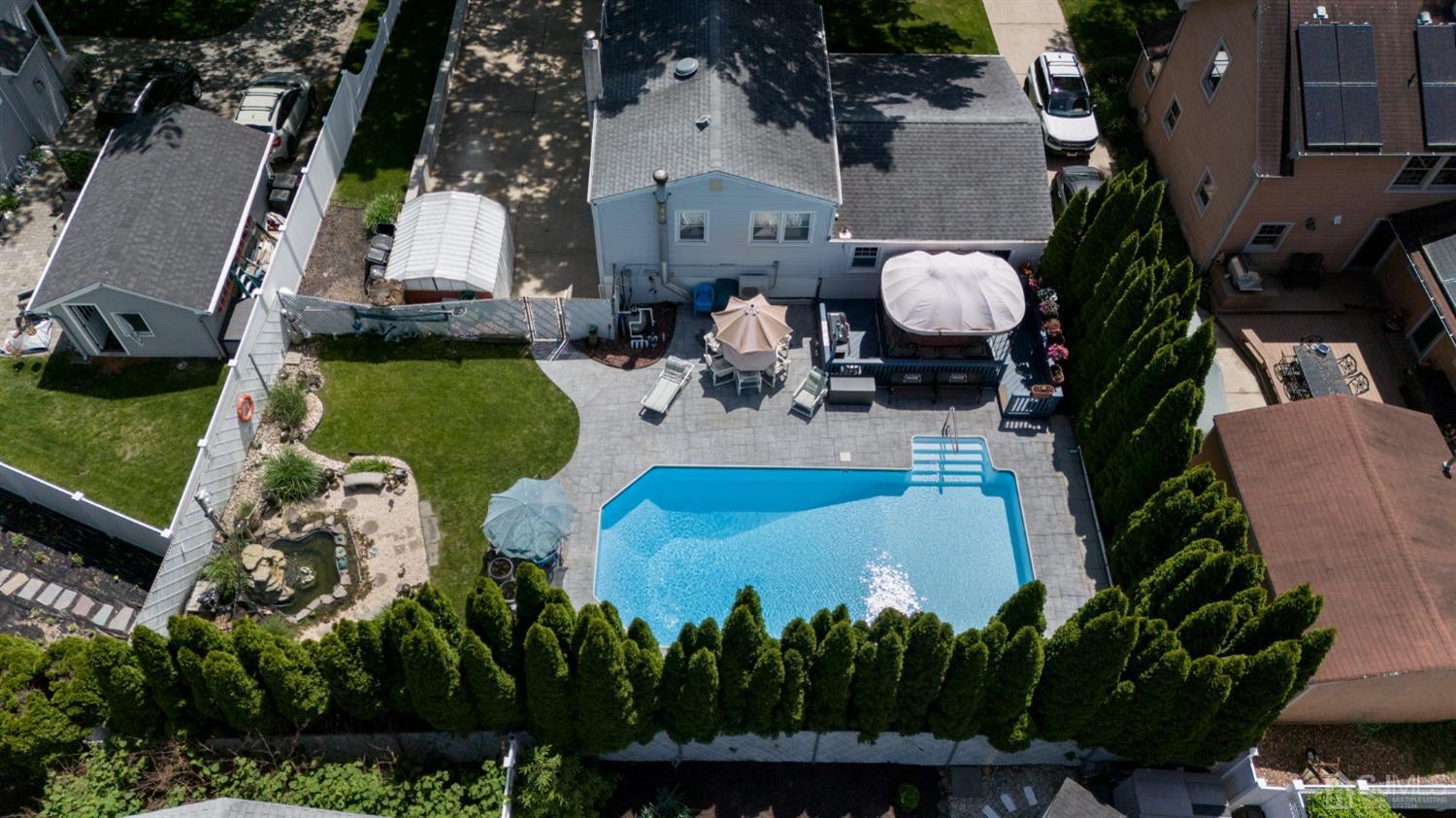 54 Manito Road Manasquan, NJ 08736 - Photo 44 of 47 an aerial view of a house with yard swimming pool and outdoor seating