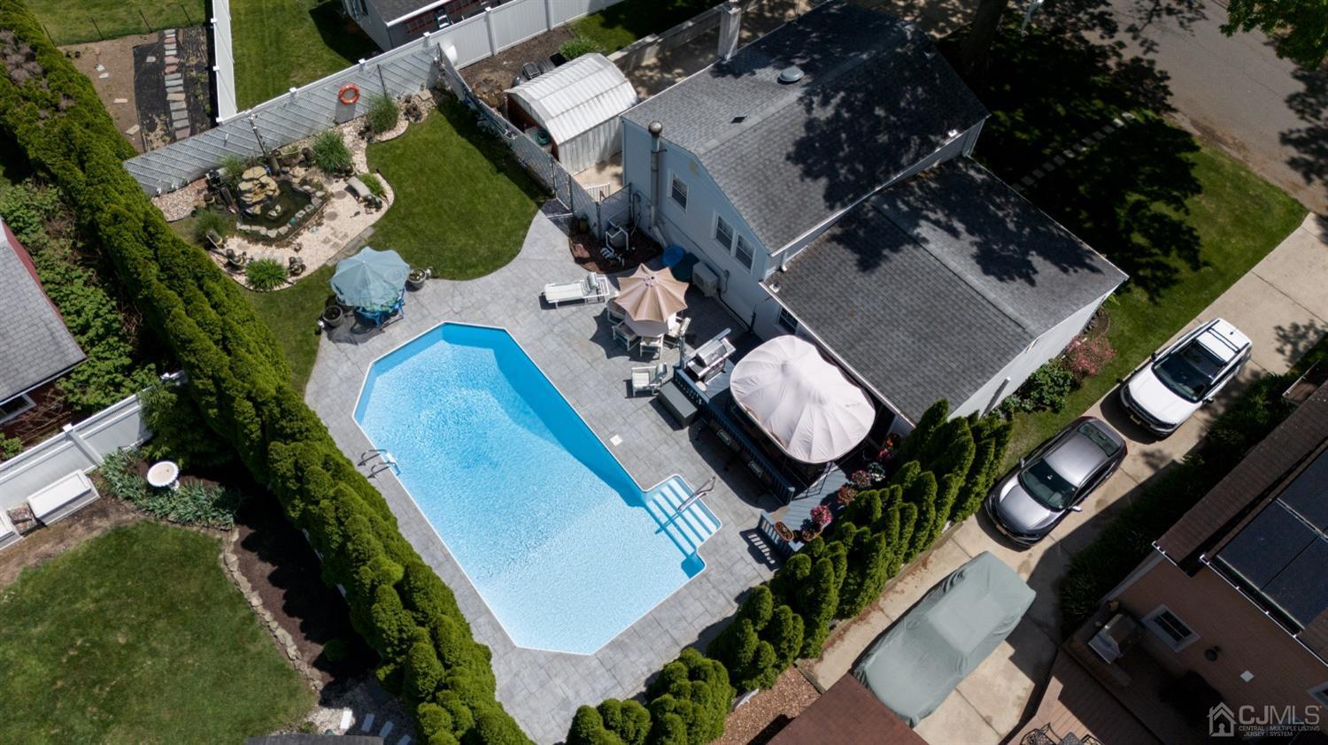 54 Manito Road Manasquan, NJ 08736 - Photo 45 of 47 an aerial view of a house swimming pool and outdoor seating