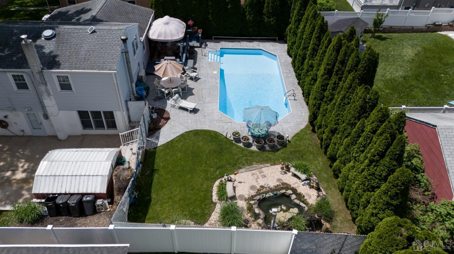 54 Manito Road Manasquan, NJ 08736 - Photo 46 of 47 an aerial view of a house with yard swimming pool and outdoor seating