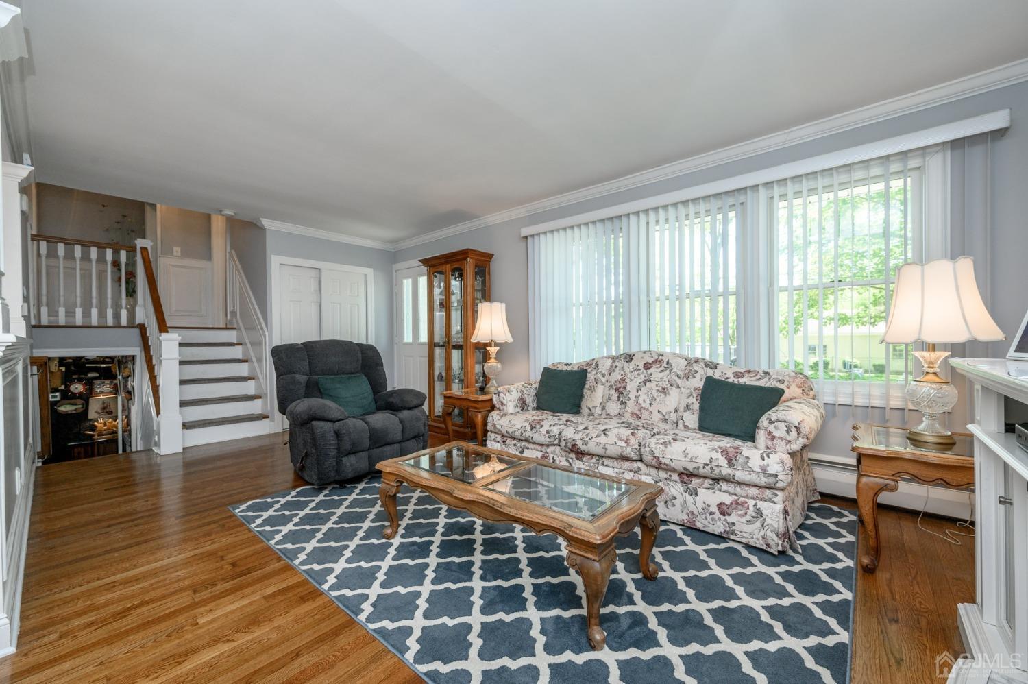 54 Manito Road Manasquan, NJ 08736 - Photo 6 of 47 a living room with furniture a rug and a large window
