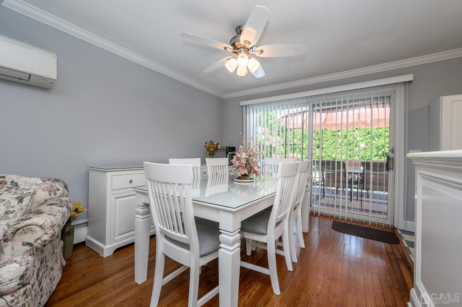 54 Manito Road Manasquan, NJ 08736 - Photo 9 of 47 a view of a dining room with furniture window and wooden floor