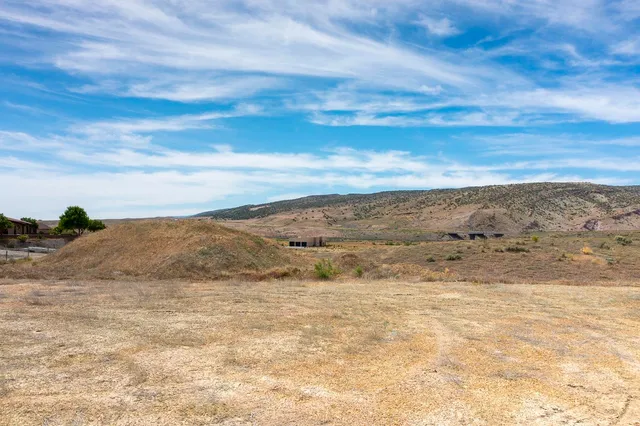 a view of ocean beach and mountain
