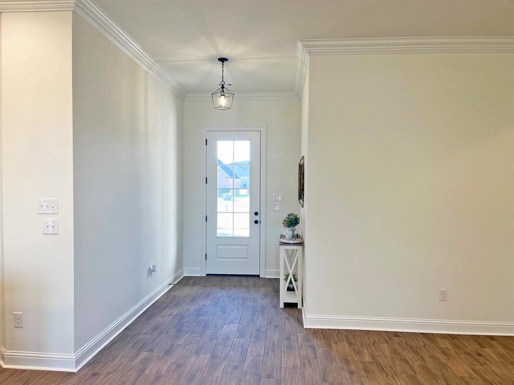 159 Lessie Drive Stonewall, LA 71078 - Photo 2 of 26 an empty room with wooden floor and windows