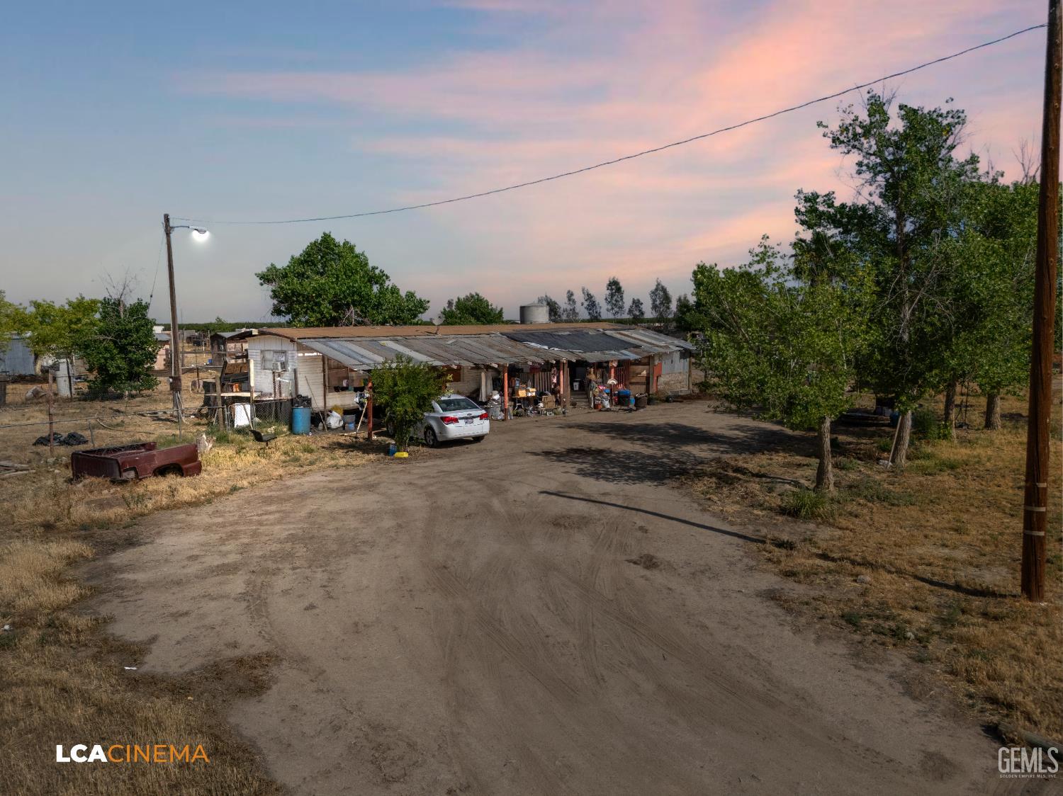Undisclosed Address Wasco, CA 93280 - Photo 2 of 42 a row of houses with outdoor space
