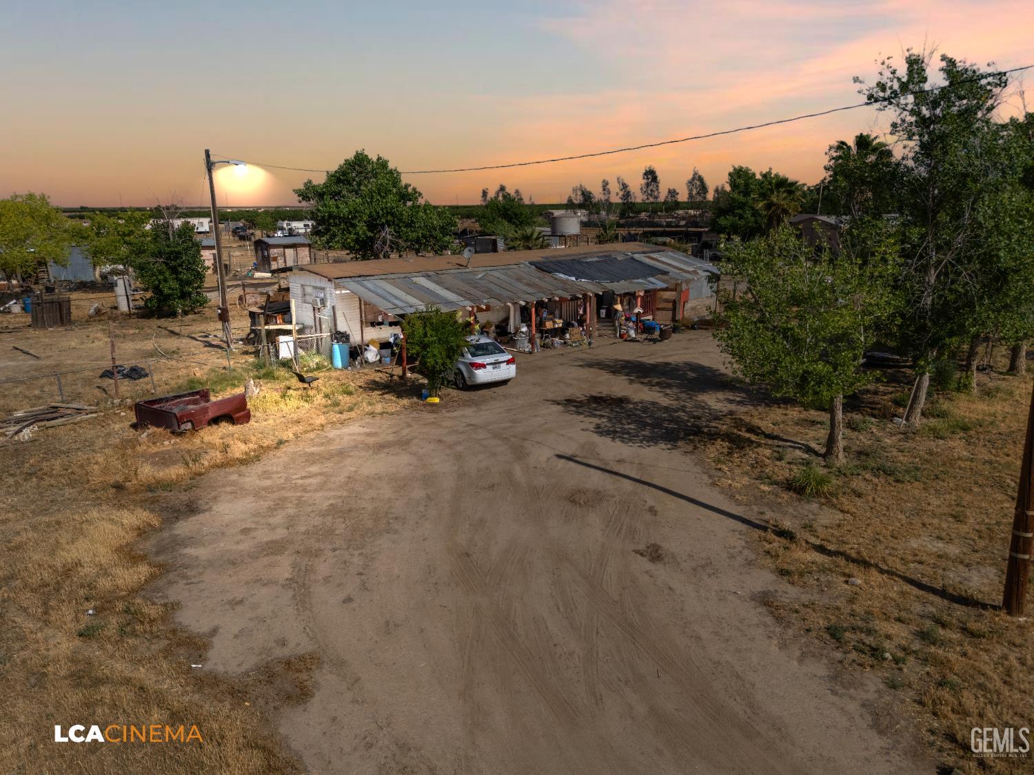 Undisclosed Address Wasco, CA 93280 - Photo 4 of 42 a view of a house with roof deck