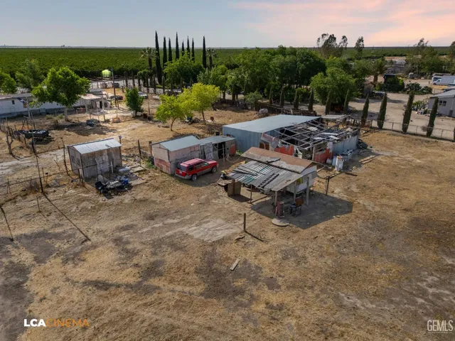 a view of a backyard with sitting area