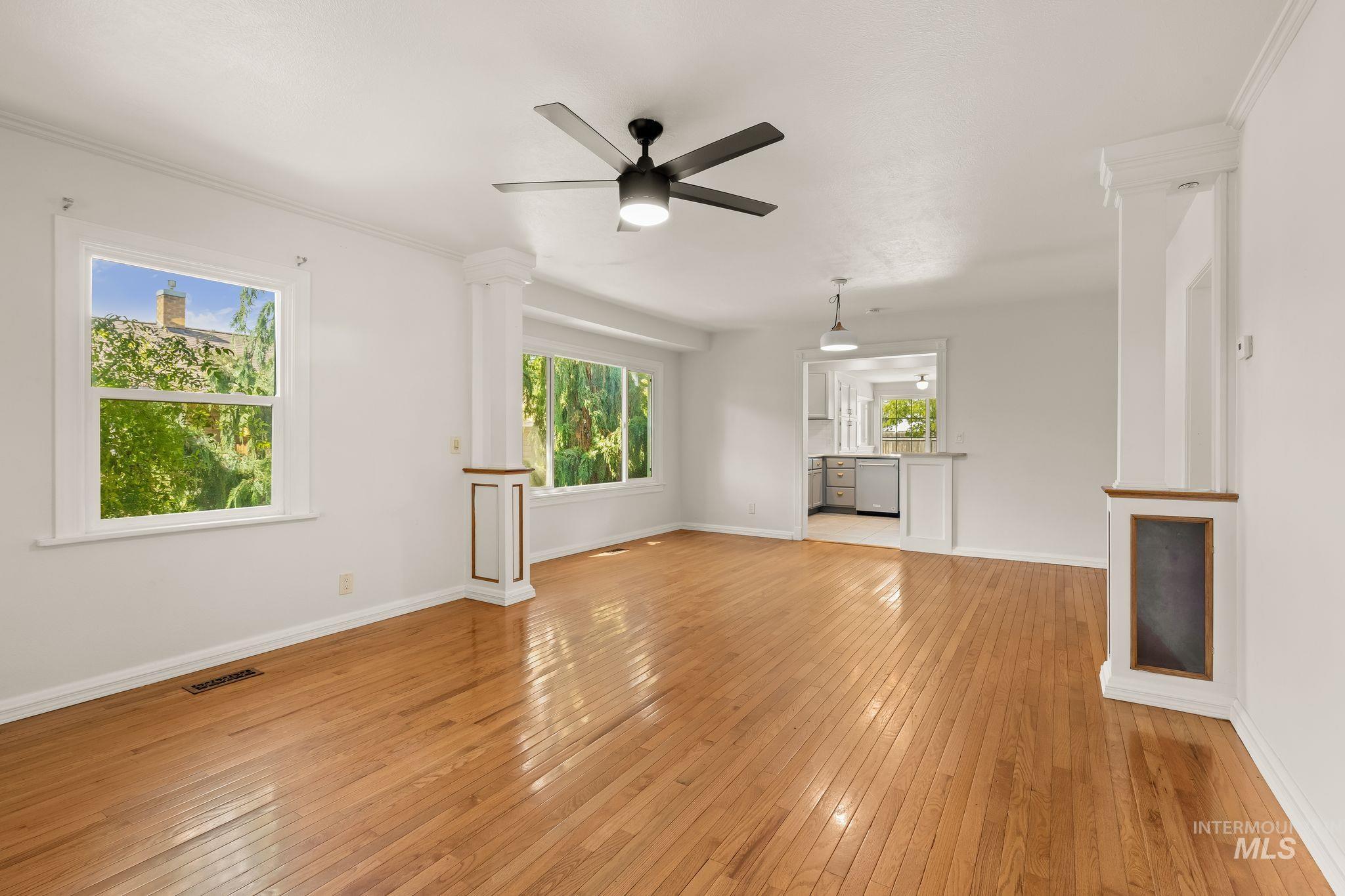 928 3rd Street Clarkston, WA 99403 - Photo 6 of 44 Hardwood flooring throughout a spacious area with white walls