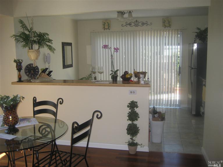672 Racquet Club Circle Rohnert Park, CA 94928 - Photo 1 of 1 a view of a dining room with furniture and wooden floor