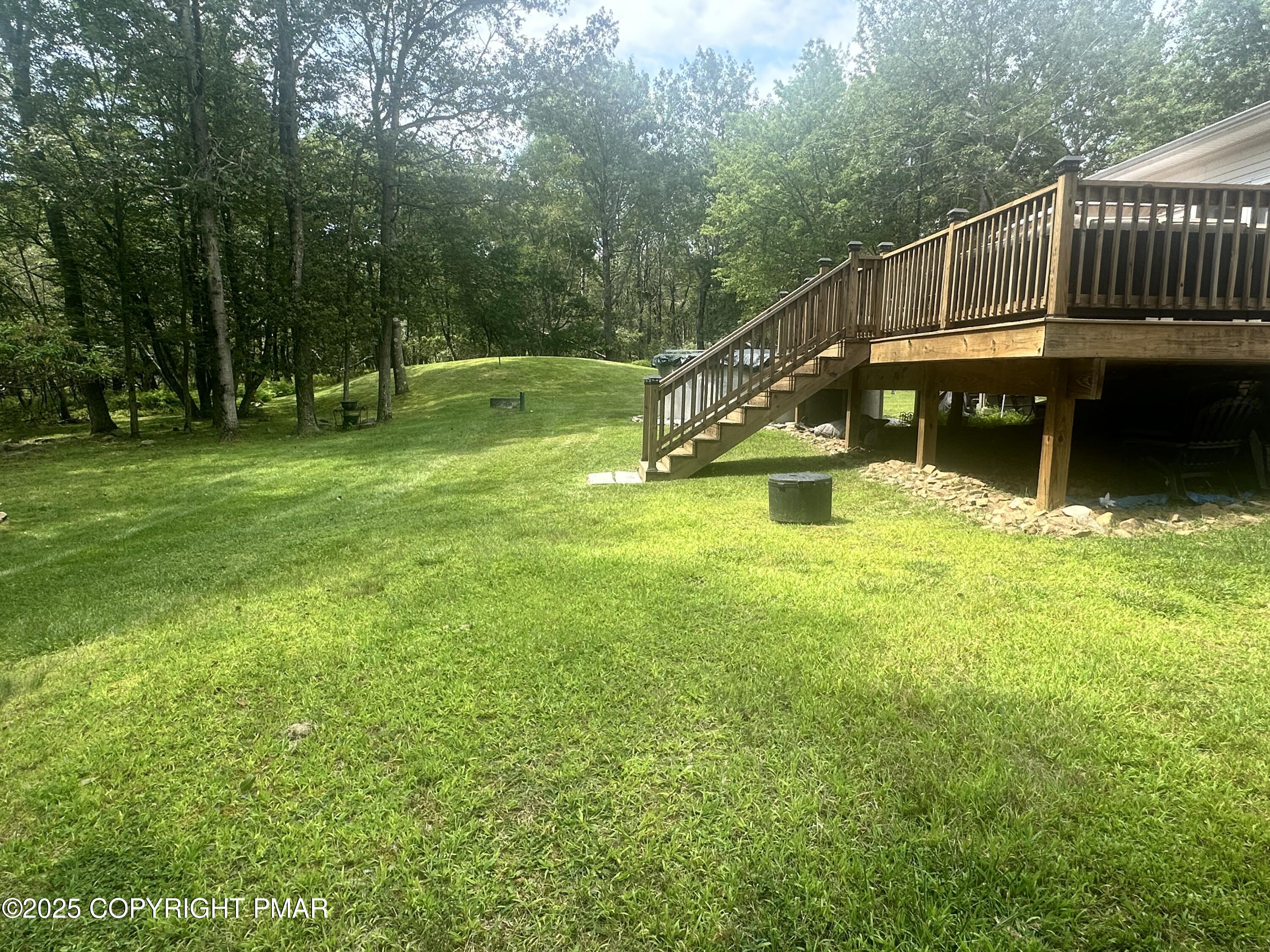107 Horseshoe Drive Effort, PA 18330 - Photo 21 of 72 a view of a garden with deck