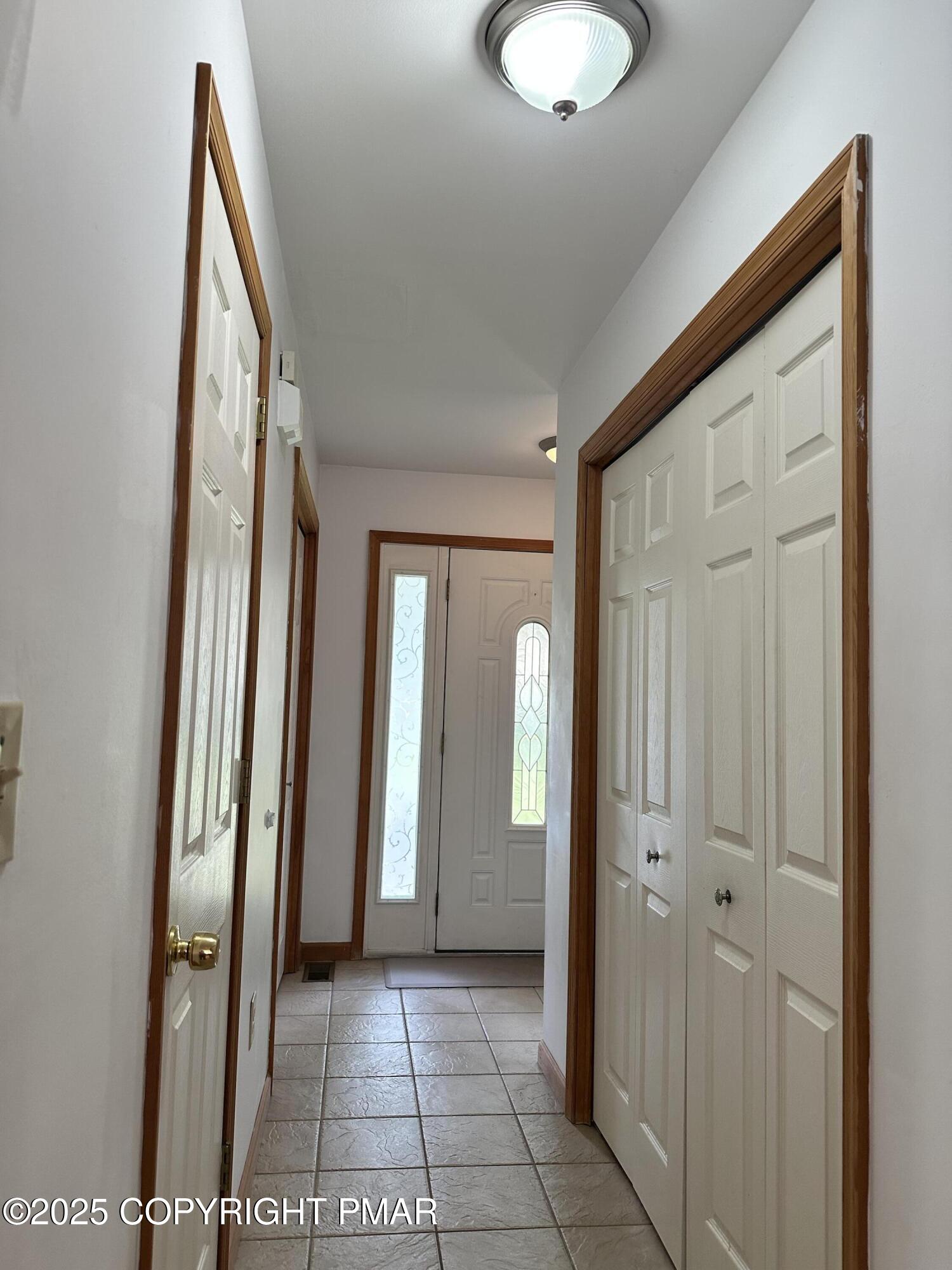 107 Horseshoe Drive Effort, PA 18330 - Photo 25 of 72 a view of a hallway with wooden floor and glass door
