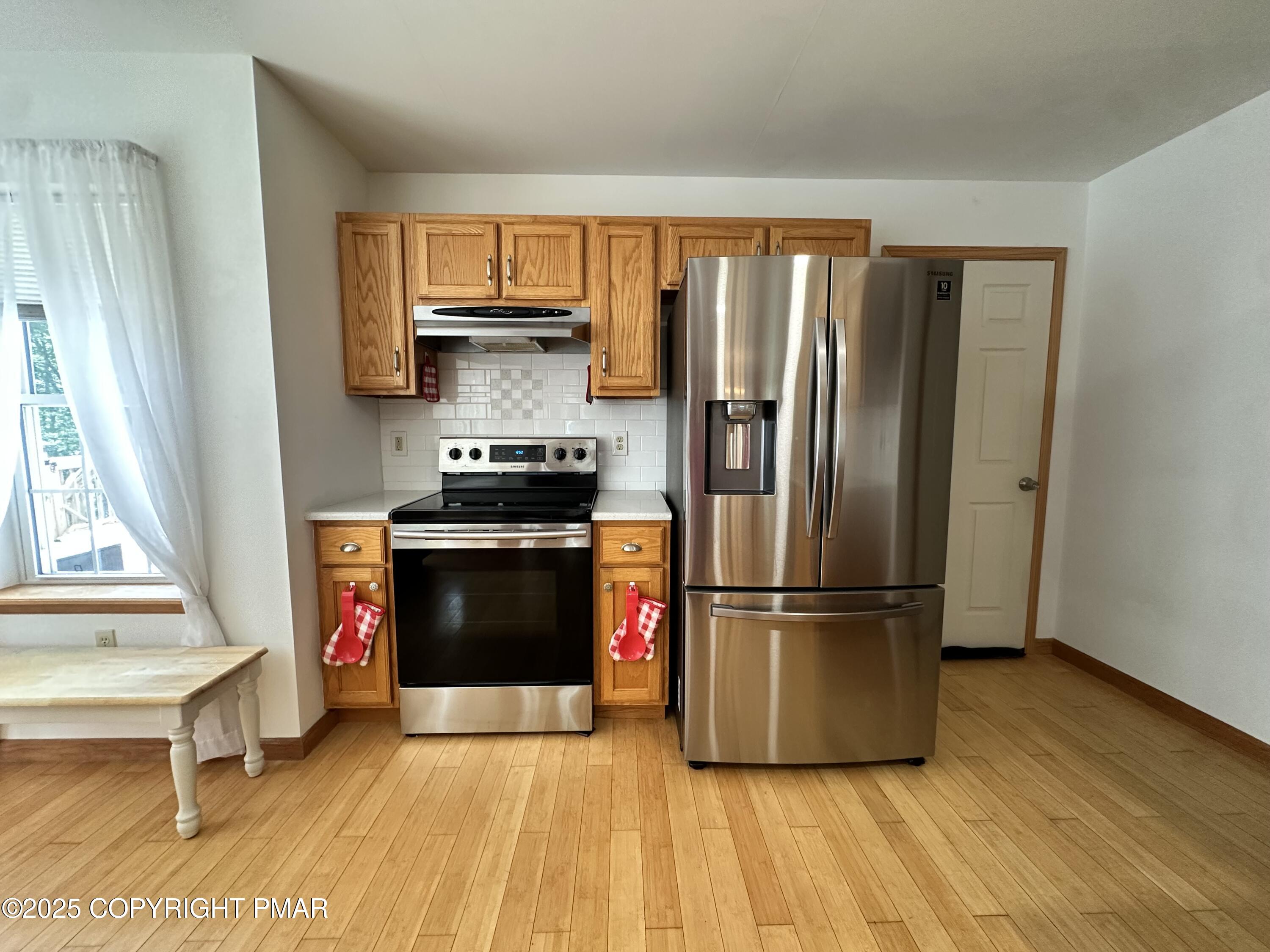 107 Horseshoe Drive Effort, PA 18330 - Photo 30 of 72 a kitchen with stainless steel appliances granite countertop a refrigerator stove and sink