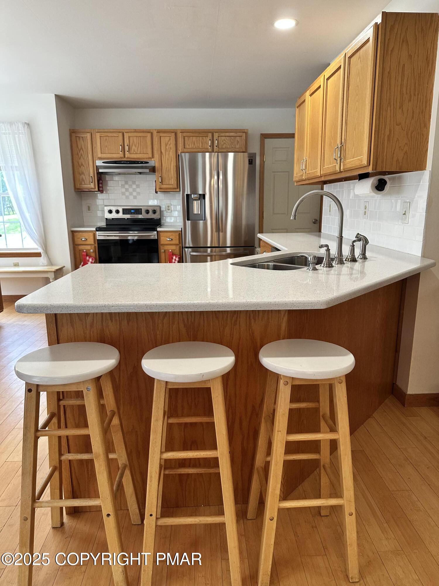 107 Horseshoe Drive Effort, PA 18330 - Photo 31 of 72 a kitchen with a dining table and chairs