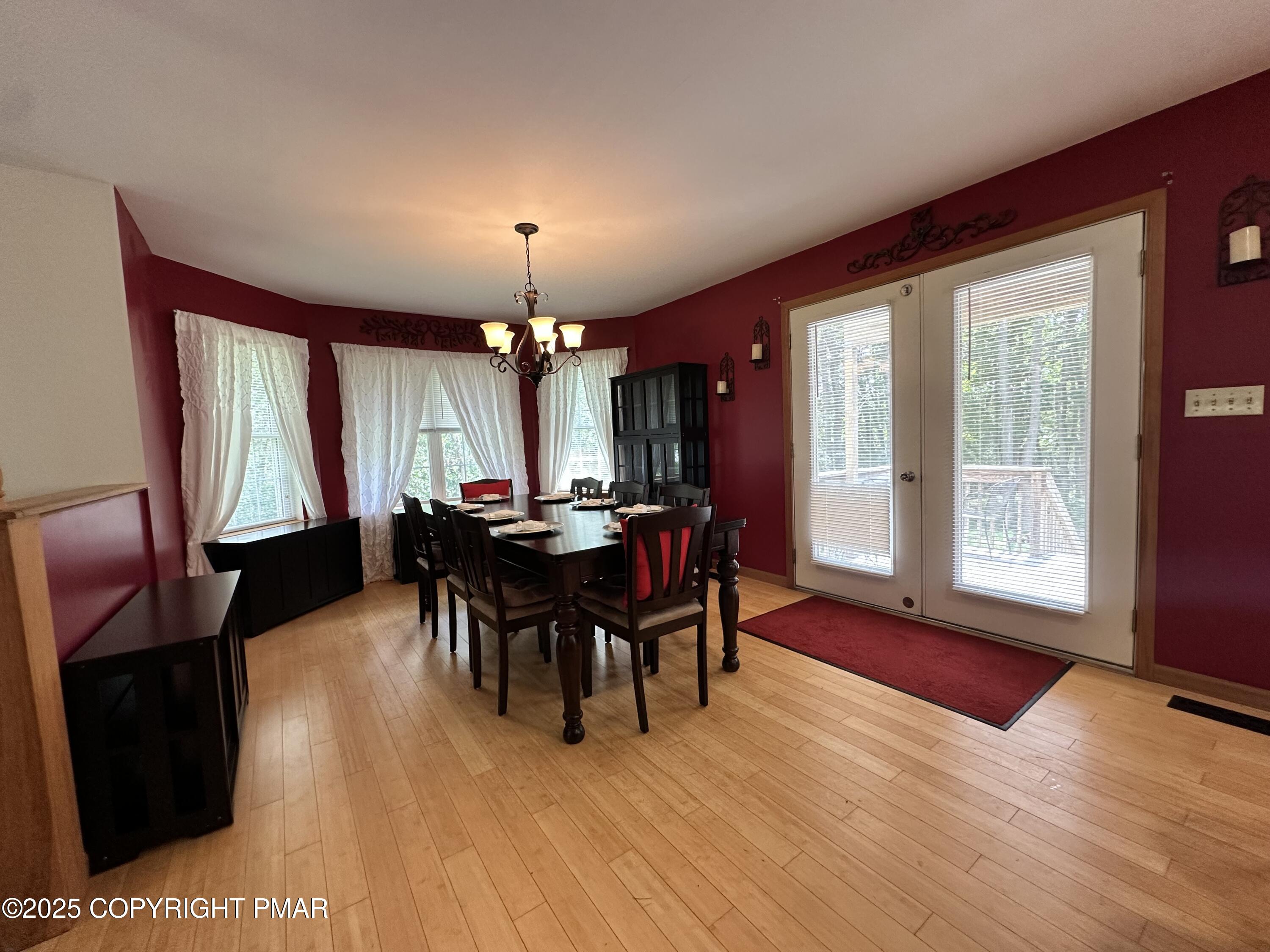 107 Horseshoe Drive Effort, PA 18330 - Photo 33 of 72 a view of a dining room with furniture window and wooden floor