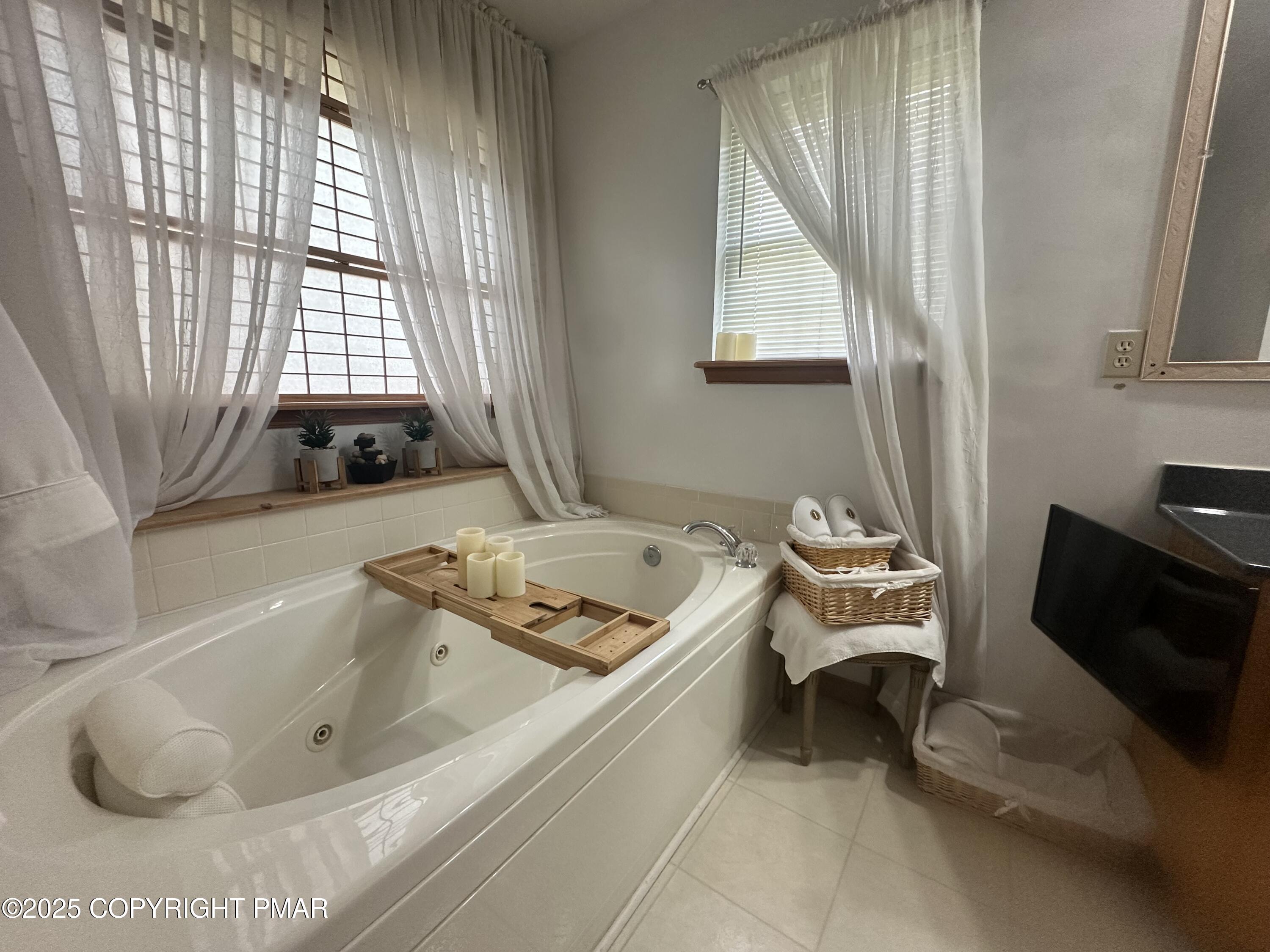 107 Horseshoe Drive Effort, PA 18330 - Photo 5 of 72 a bathroom with a tub sink and window