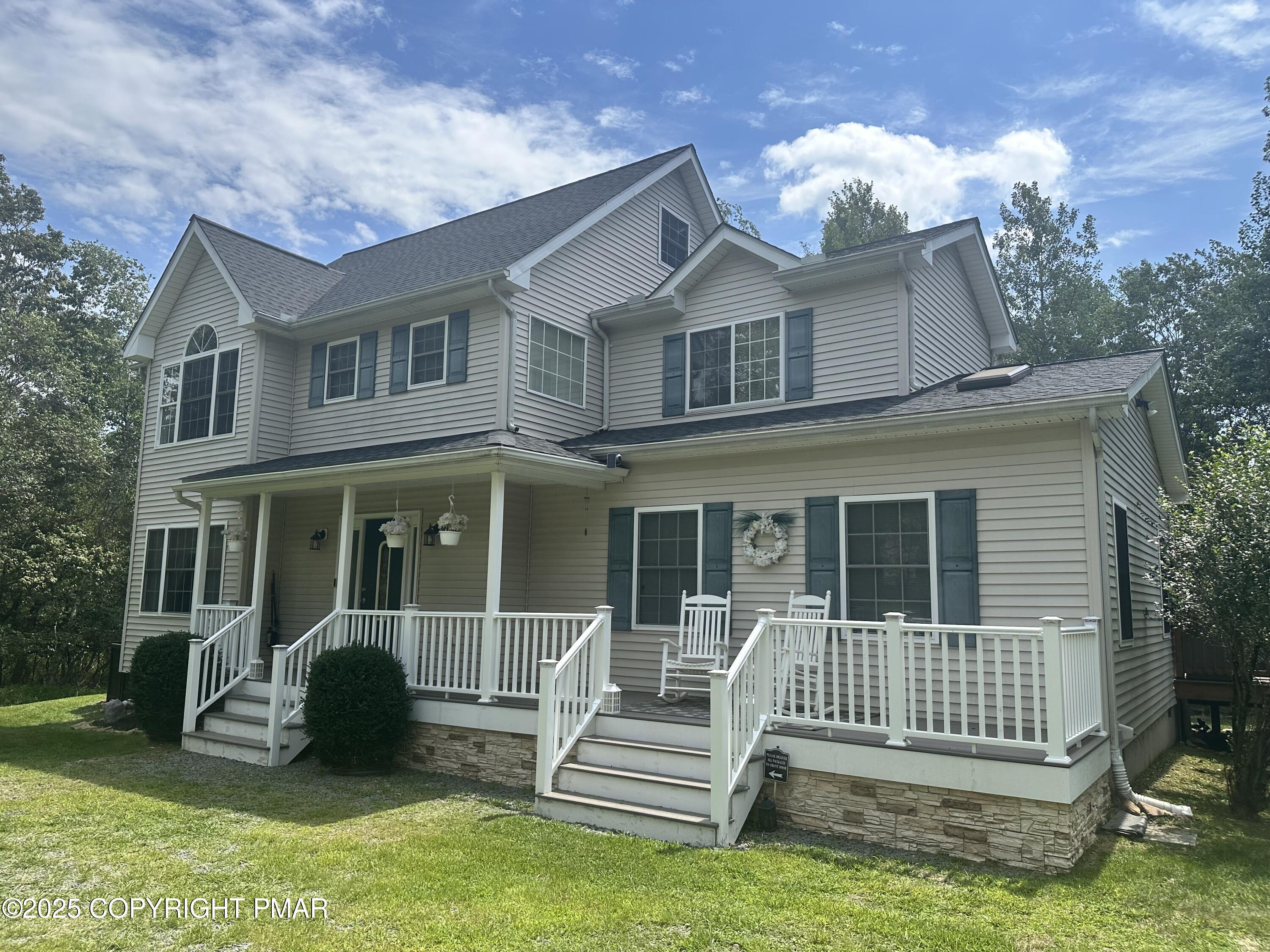 107 Horseshoe Drive Effort, PA 18330 - Photo 9 of 72 a front view of a house with a garden