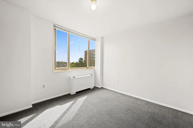a view of an empty room with a window