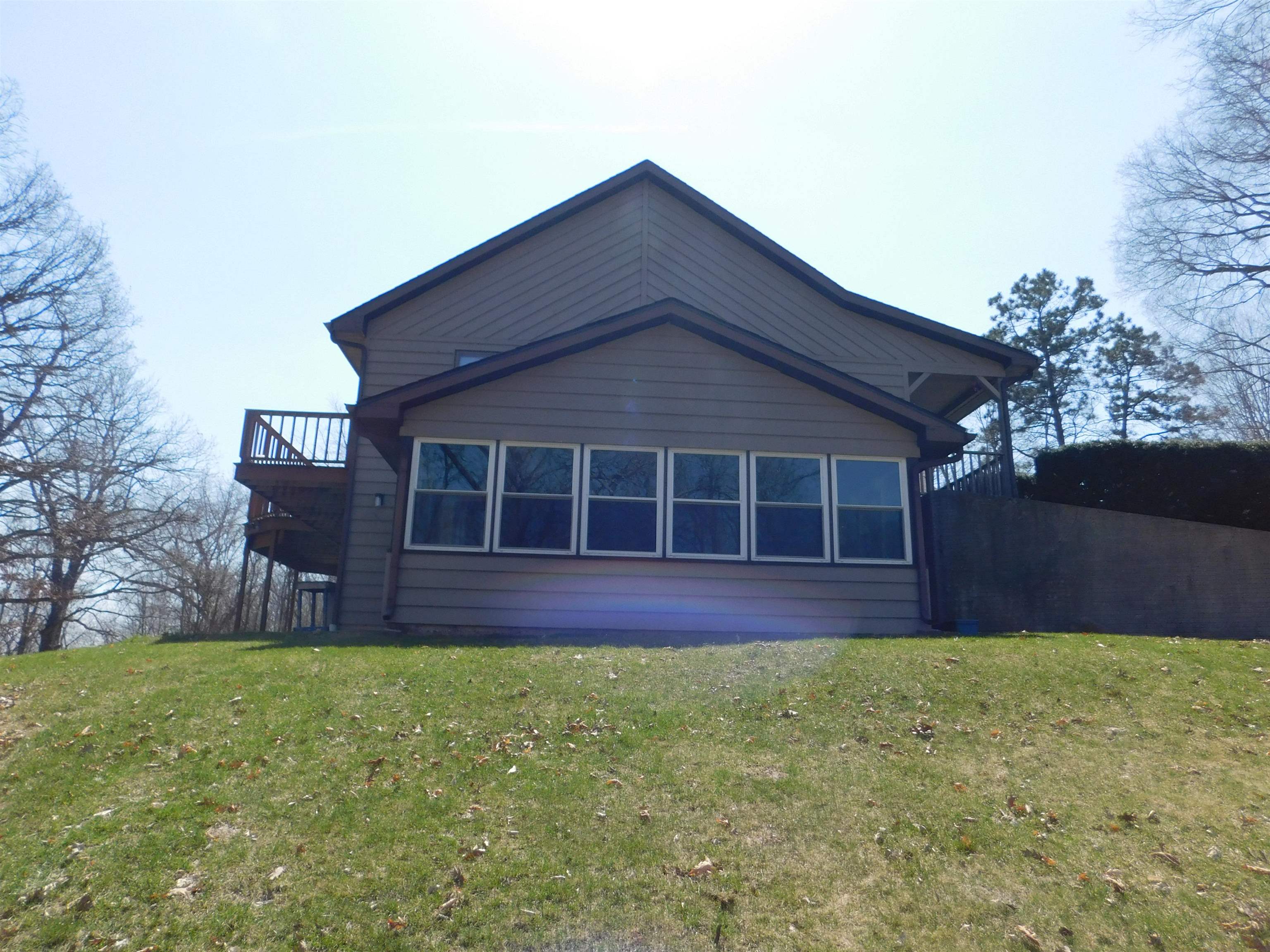 4103 North AYP Road Lena, IL 61048 - Photo 14 of 96 a front view of a house with a garden