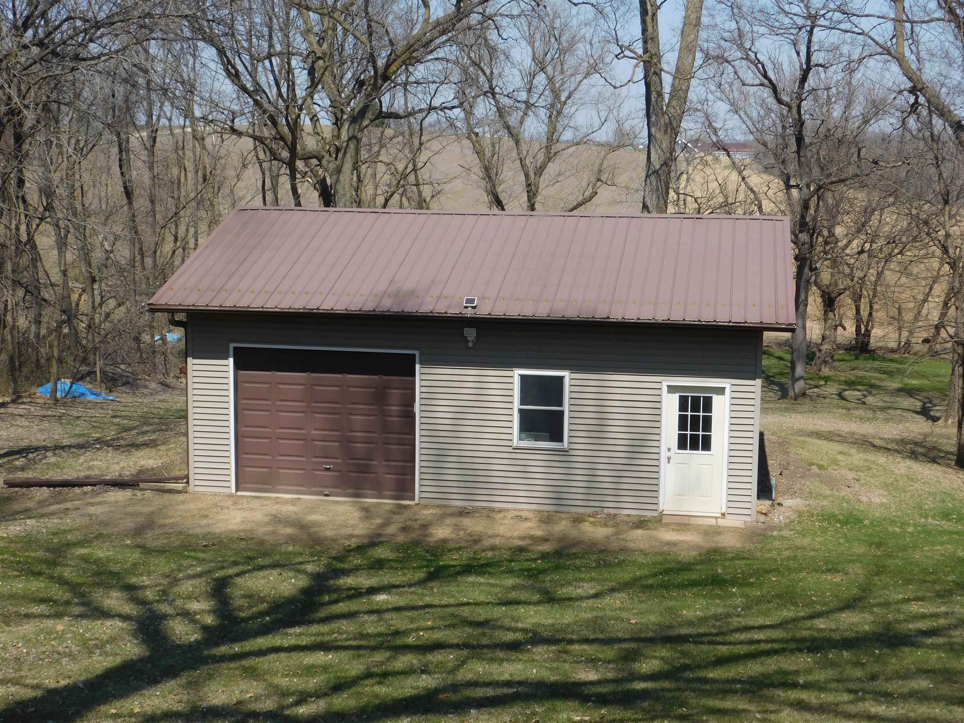4103 North AYP Road Lena, IL 61048 - Photo 16 of 96 a front view of a house with a garden