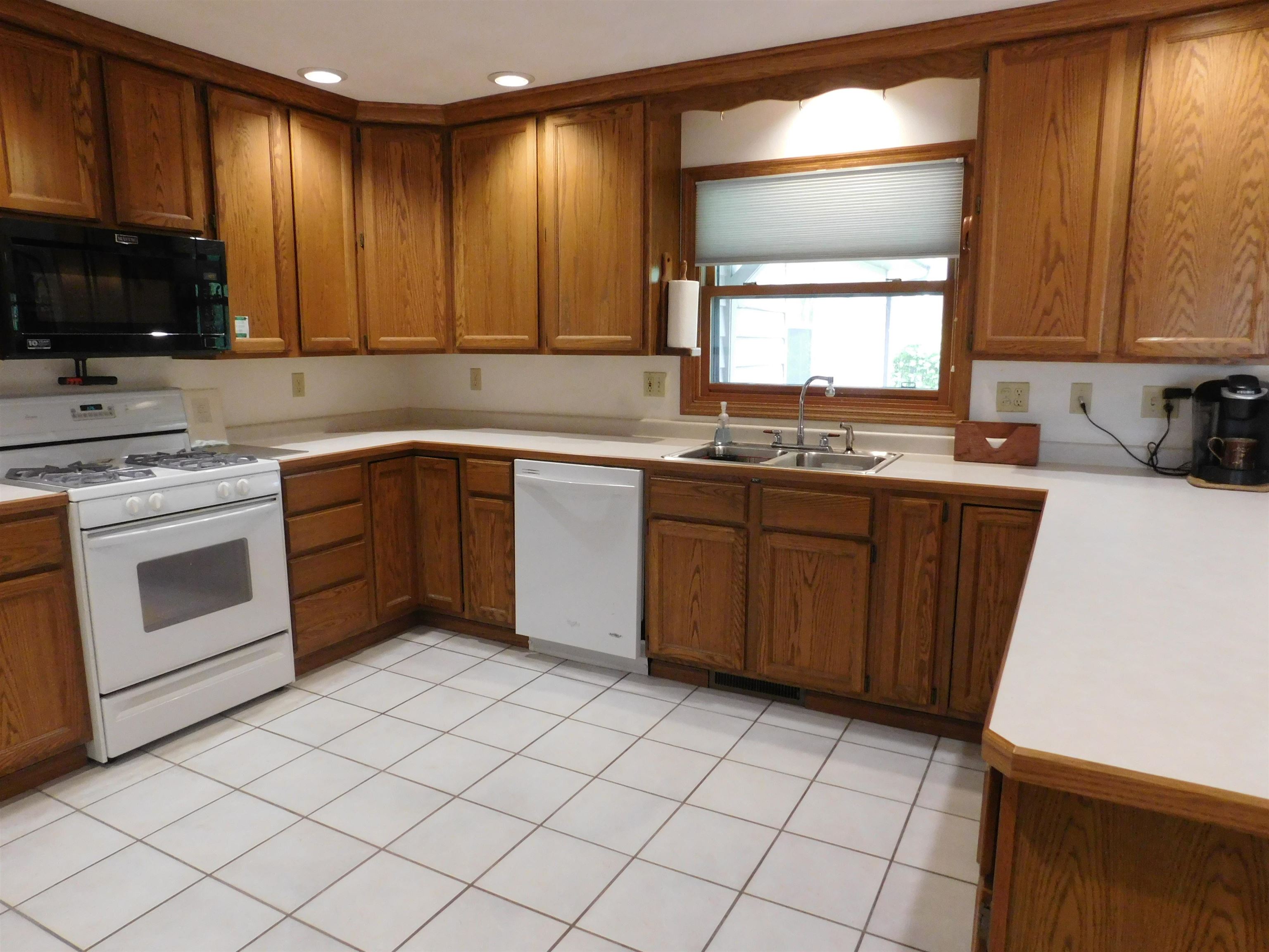 4103 North AYP Road Lena, IL 61048 - Photo 48 of 96 a kitchen with a sink stove and cabinets