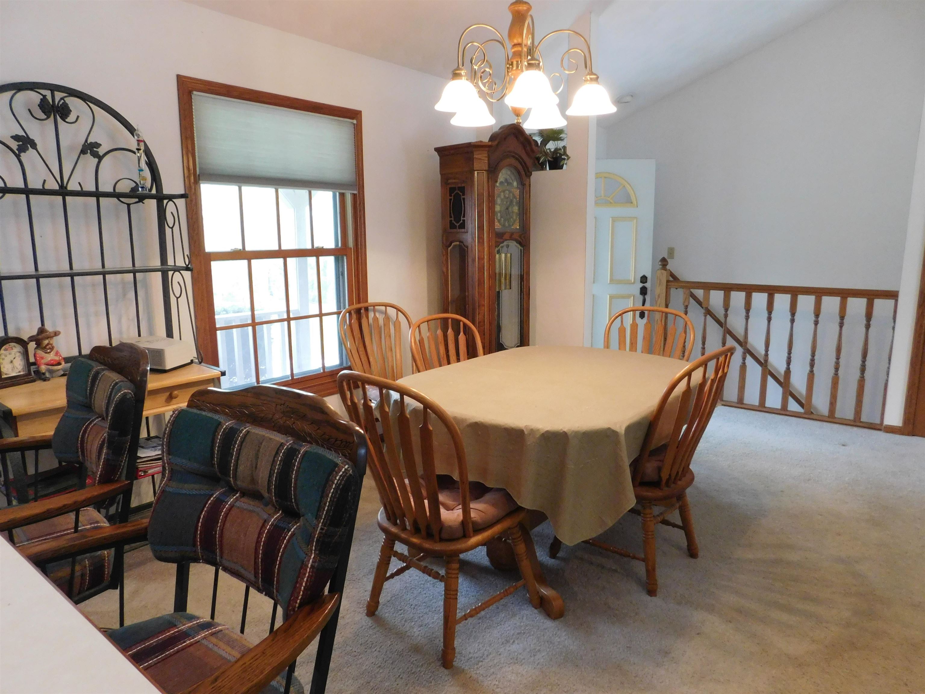 4103 North AYP Road Lena, IL 61048 - Photo 50 of 96 a view of a dining room with furniture and a chandelier