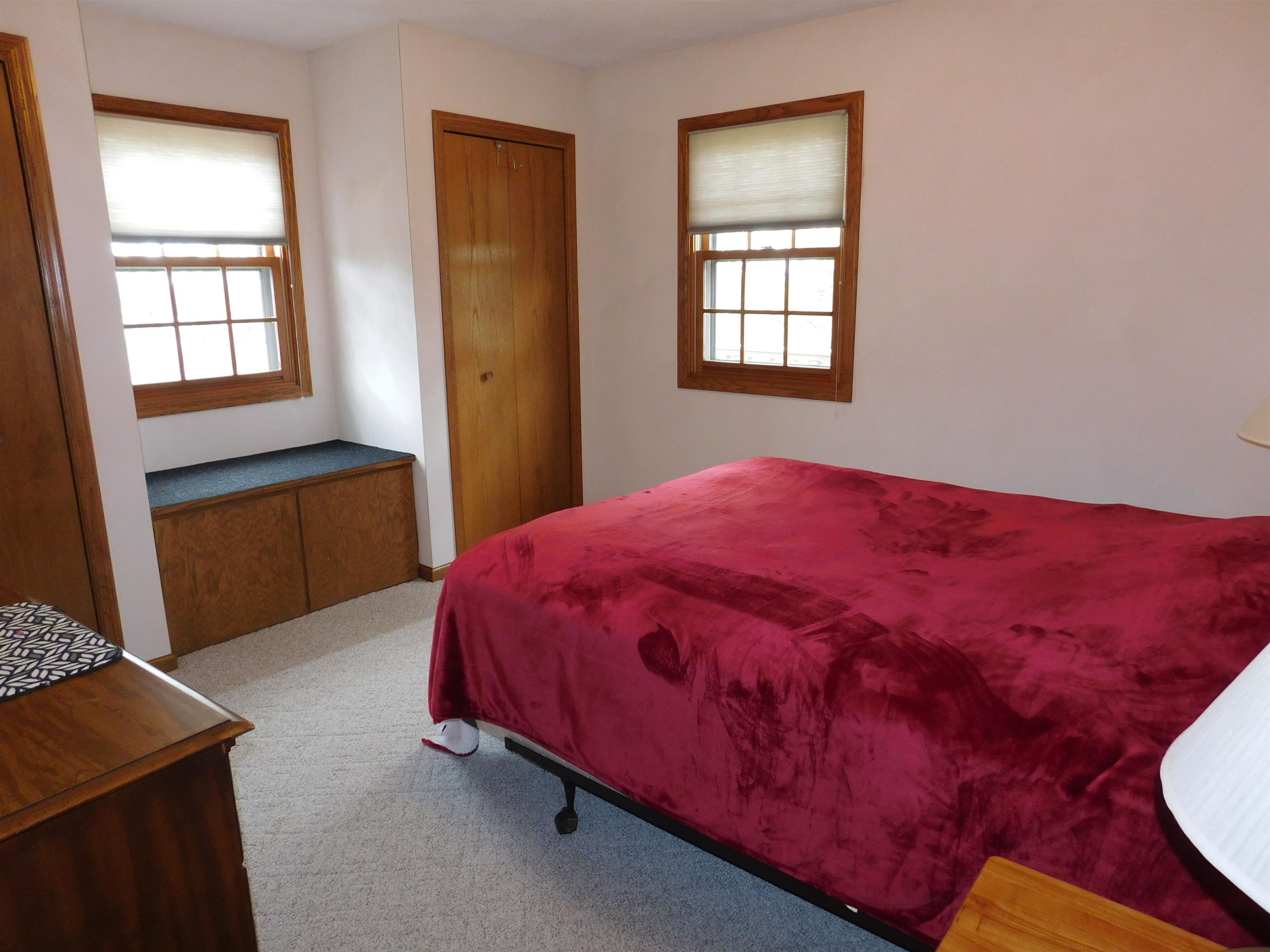 4103 North AYP Road Lena, IL 61048 - Photo 54 of 96 a bed sitting in a bedroom next to a window