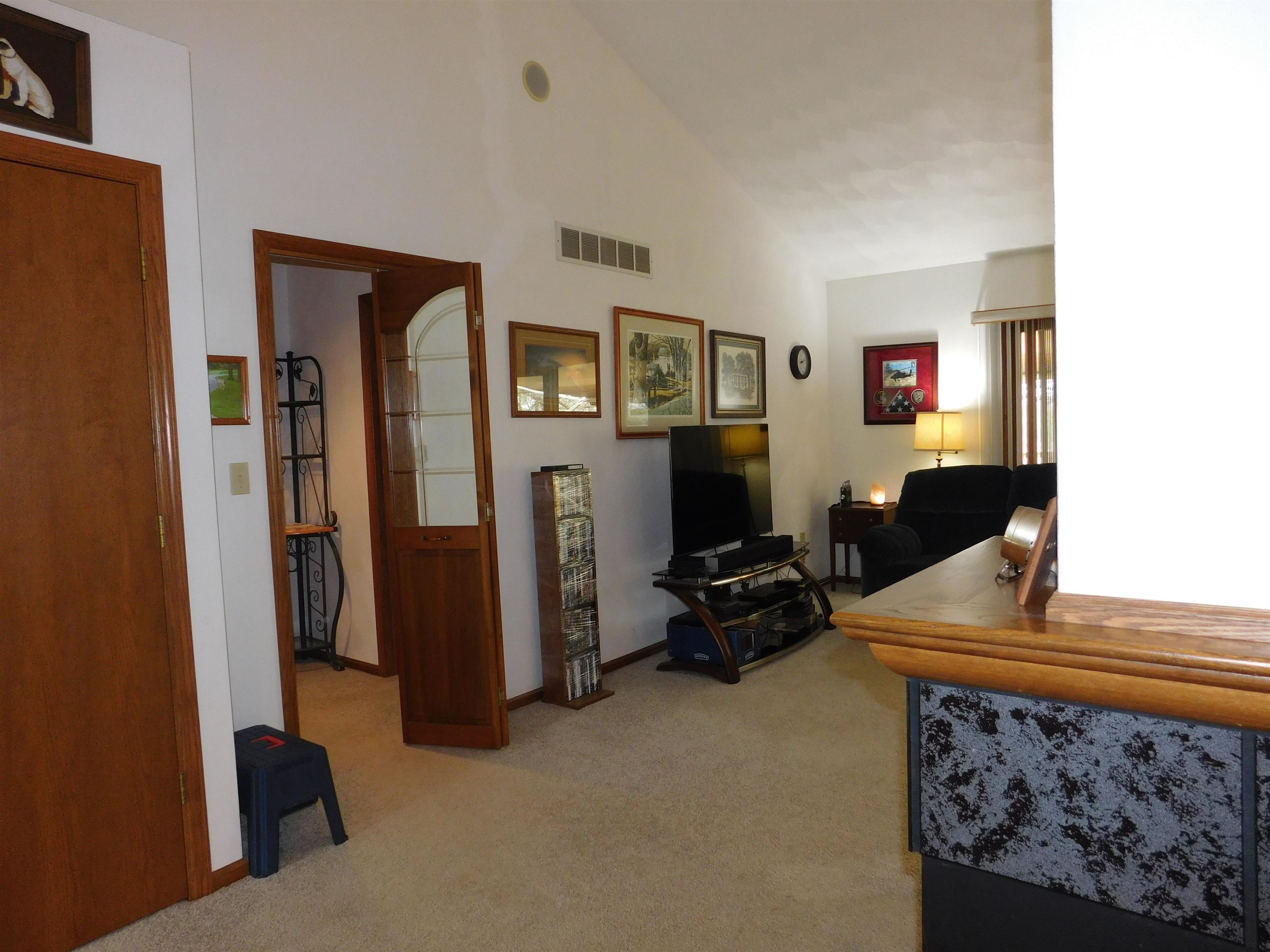 4103 North AYP Road Lena, IL 61048 - Photo 60 of 96 a living room with furniture and a flat screen tv