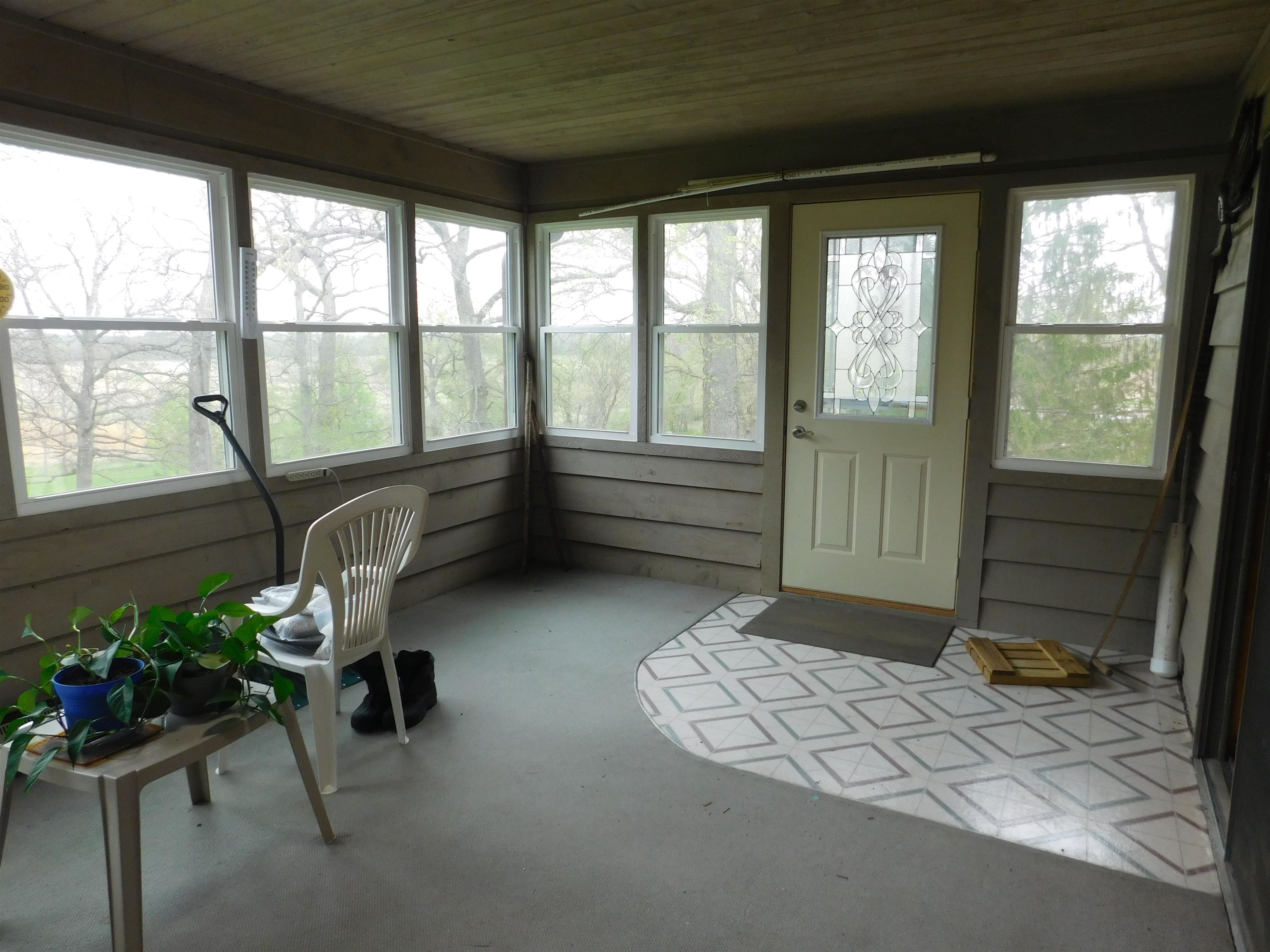 4103 North AYP Road Lena, IL 61048 - Photo 88 of 96 a room with gym equipment and a large window