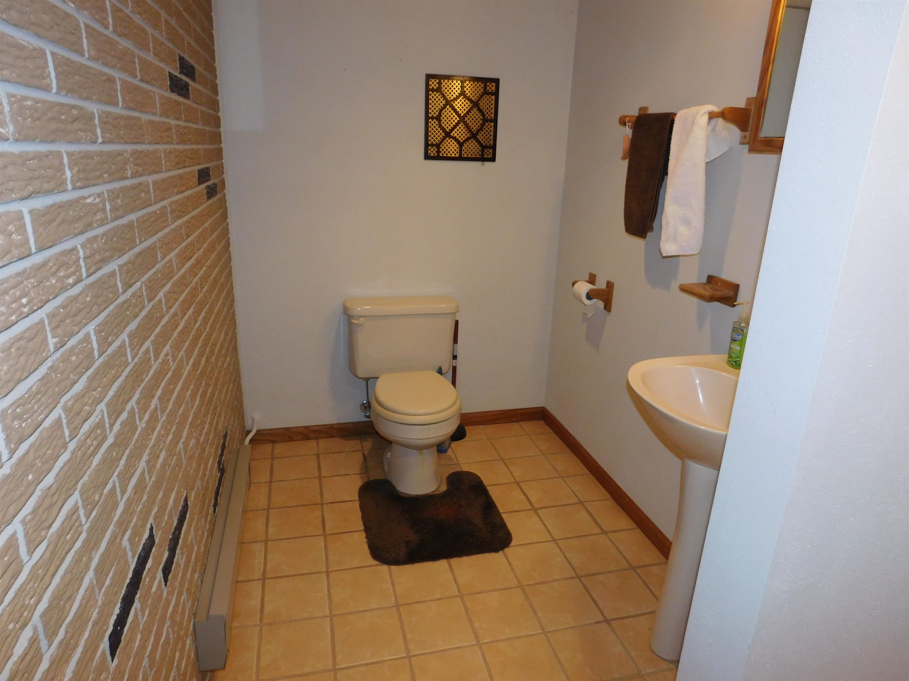 4103 North AYP Road Lena, IL 61048 - Photo 92 of 96 a bathroom with a toilet and a sink