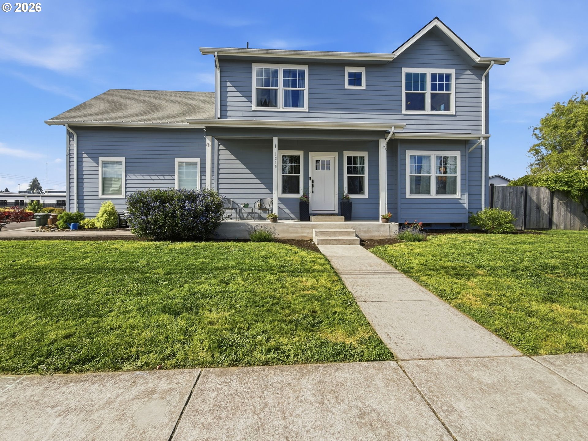 1310 Elm Street Junction City, OR 97448 - Photo 1 of 39 front view of a brick house with a yard