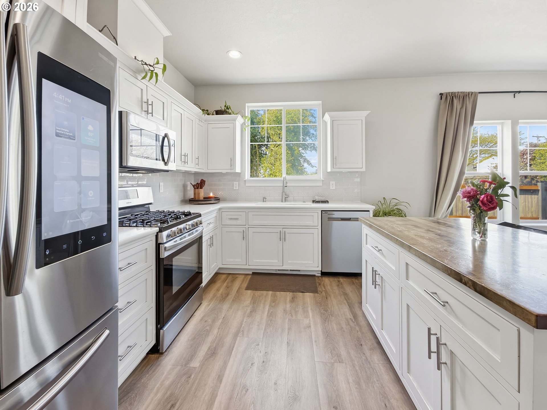 1310 Elm Street Junction City, OR 97448 - Photo 11 of 39 a kitchen with a white stove top oven sink and window