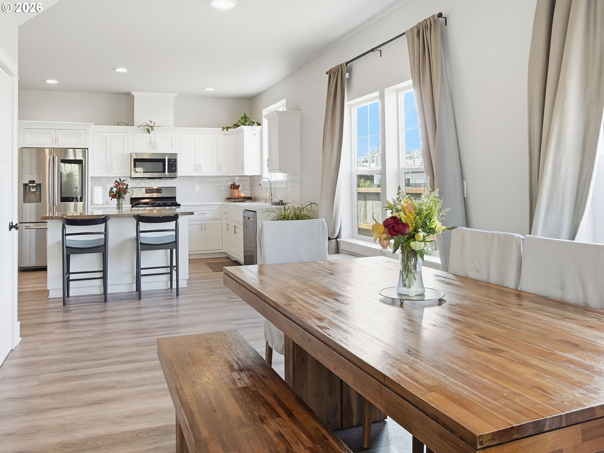 1310 Elm Street Junction City, OR 97448 - Photo 14 of 39 a kitchen with cabinets wooden floor and stainless steel appliances