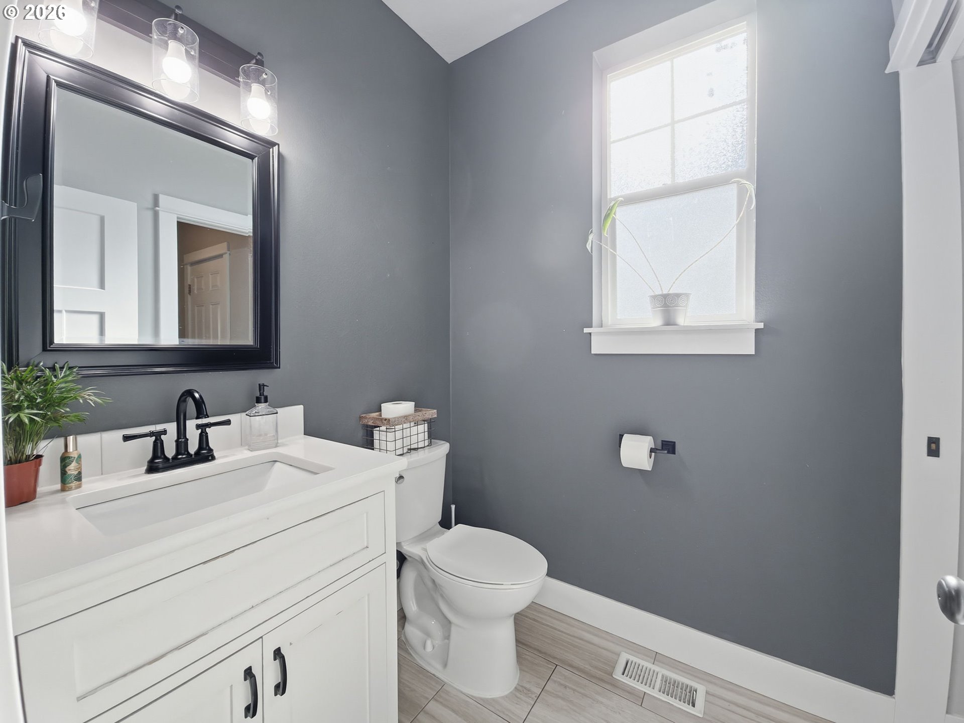 1310 Elm Street Junction City, OR 97448 - Photo 23 of 39 a bathroom with a toilet sink and mirror