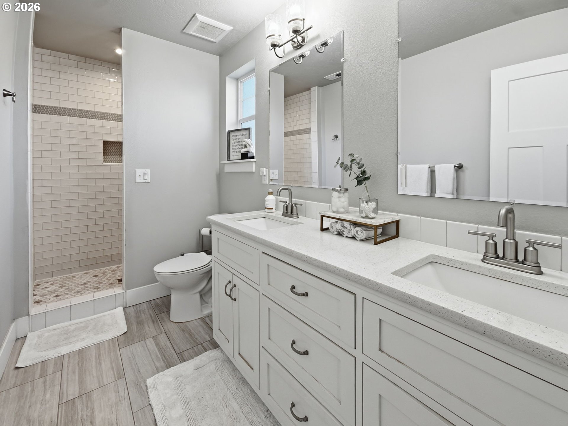 1310 Elm Street Junction City, OR 97448 - Photo 28 of 39 a bathroom with a double vanity sink toilet and shower
