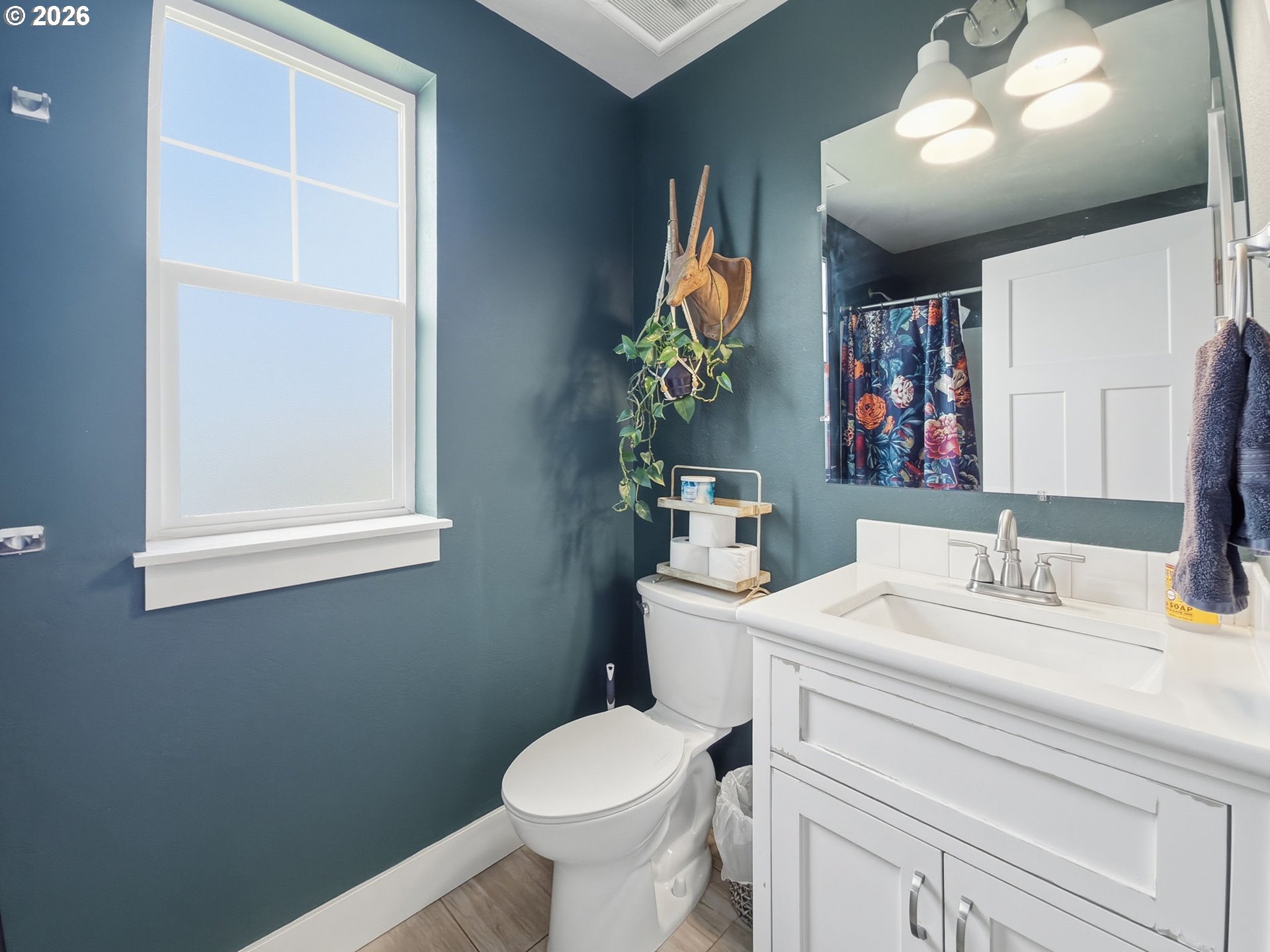 1310 Elm Street Junction City, OR 97448 - Photo 30 of 39 a bathroom with a toilet sink and mirror