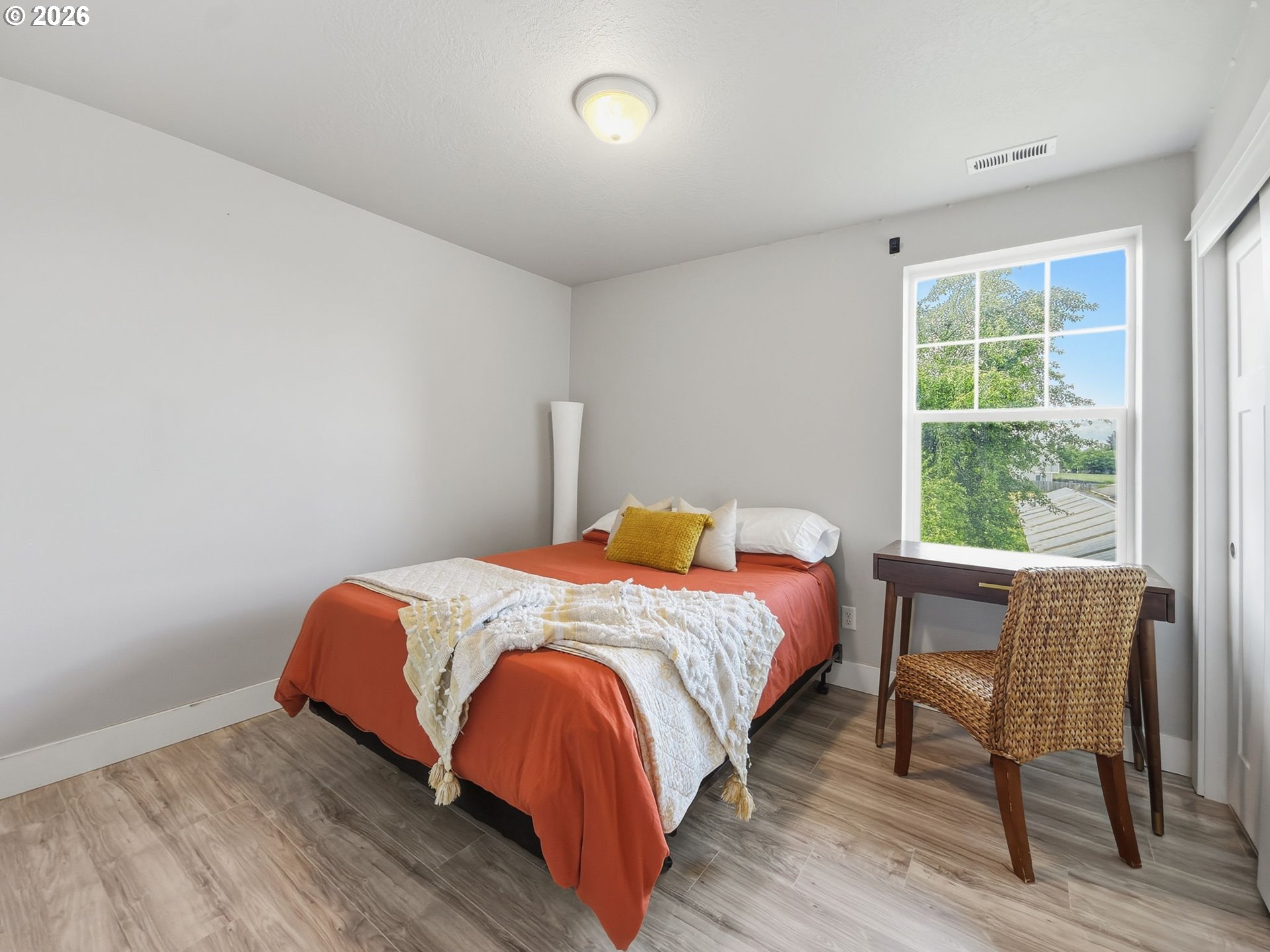 1310 Elm Street Junction City, OR 97448 - Photo 31 of 39 a bedroom with a bed and a table