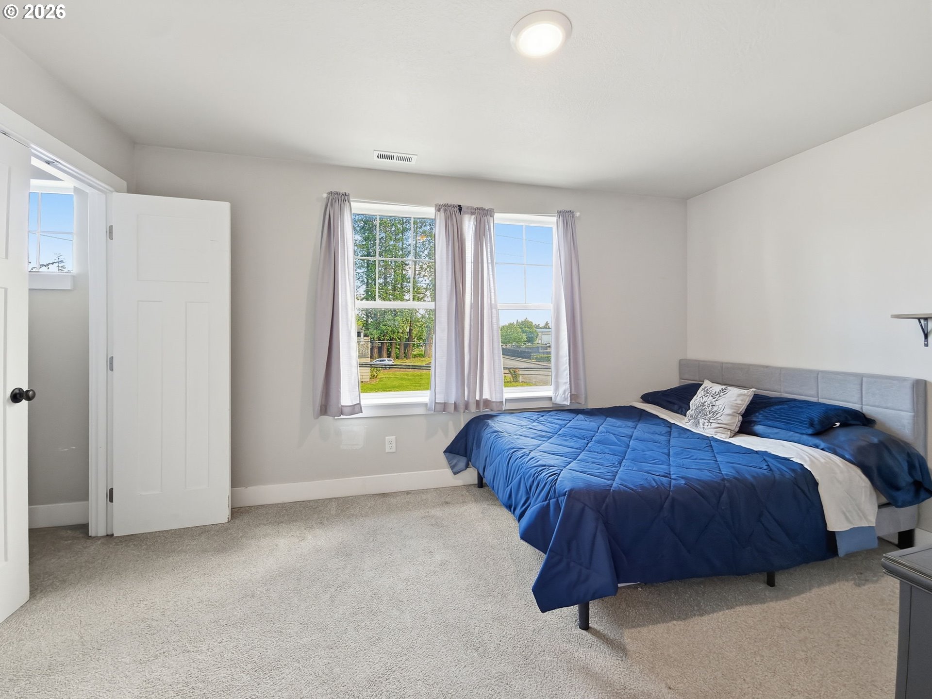 1310 Elm Street Junction City, OR 97448 - Photo 33 of 39 a bedroom with a bed and a cabinets