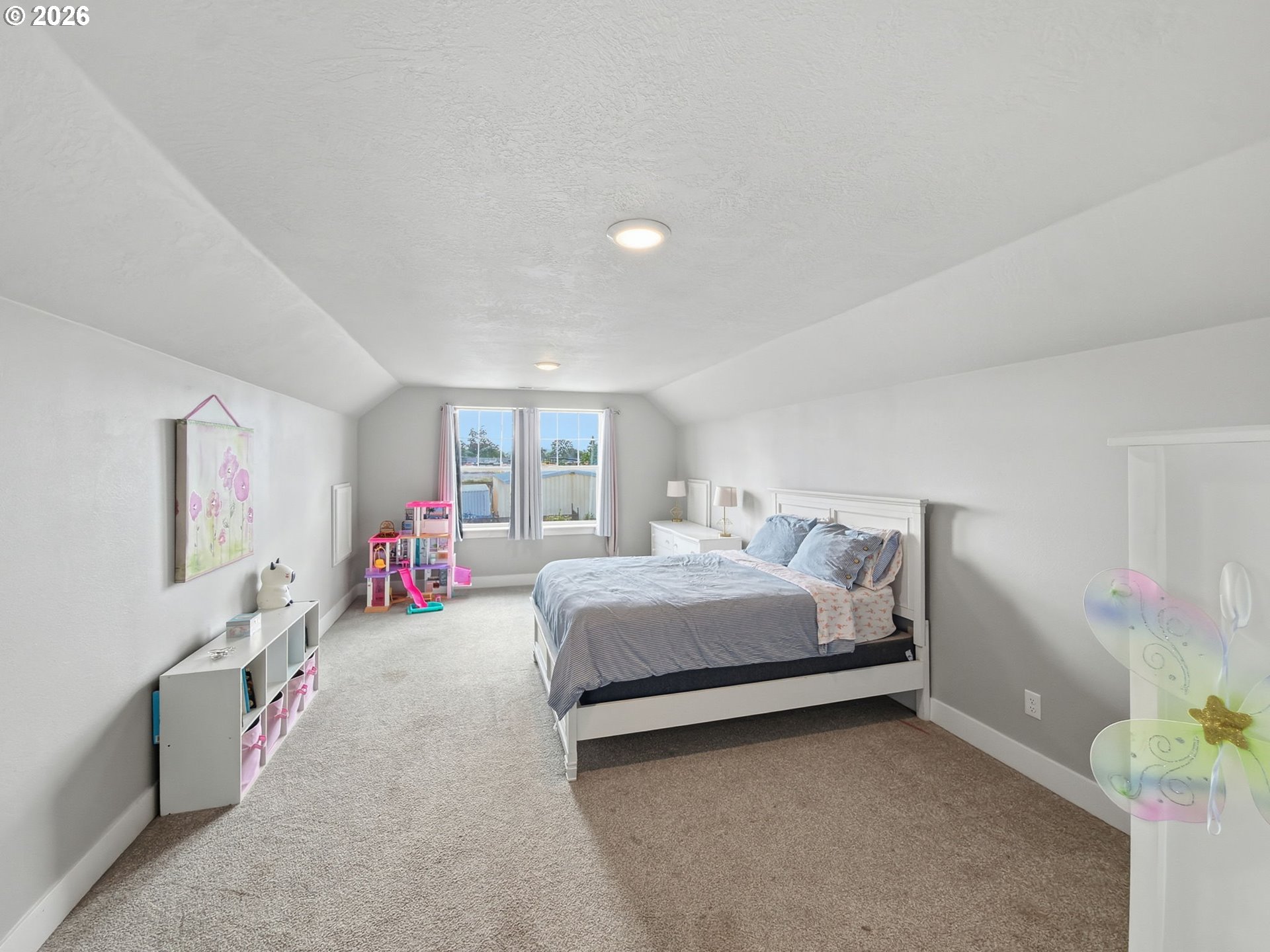 1310 Elm Street Junction City, OR 97448 - Photo 34 of 39 a bed room with a bed and a window